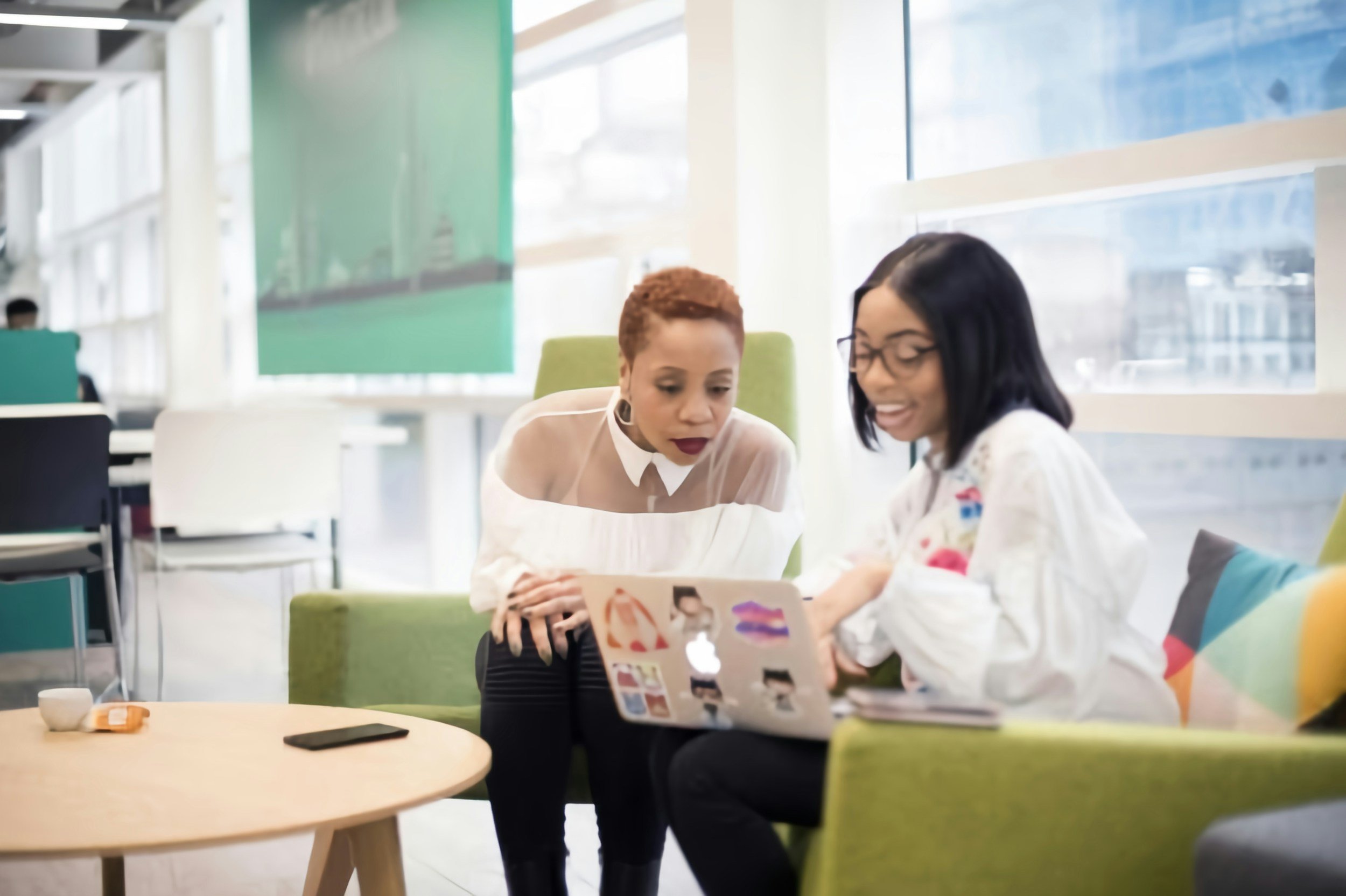 Doctor seated with a patient during a supportive medical consultation related to autism care.