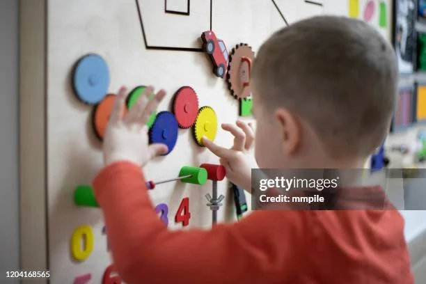 Child playing with spinning toys