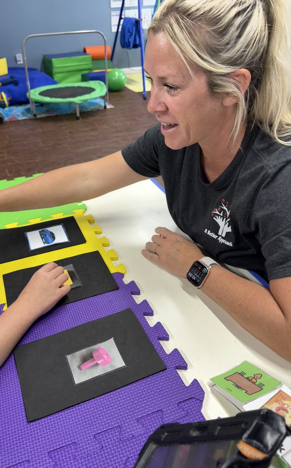 Adult women working on matching skill with young child