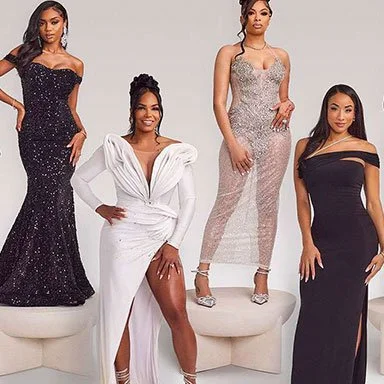 Four women in elegant evening gowns pose in front of a white background.