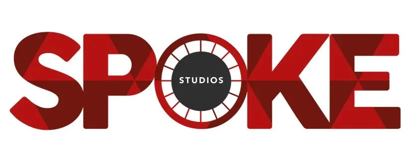Logo for Spoke Studios with the word 'SPOKE' in red and black, featuring a circular clock-like design with 'STUDIOS' in the center.