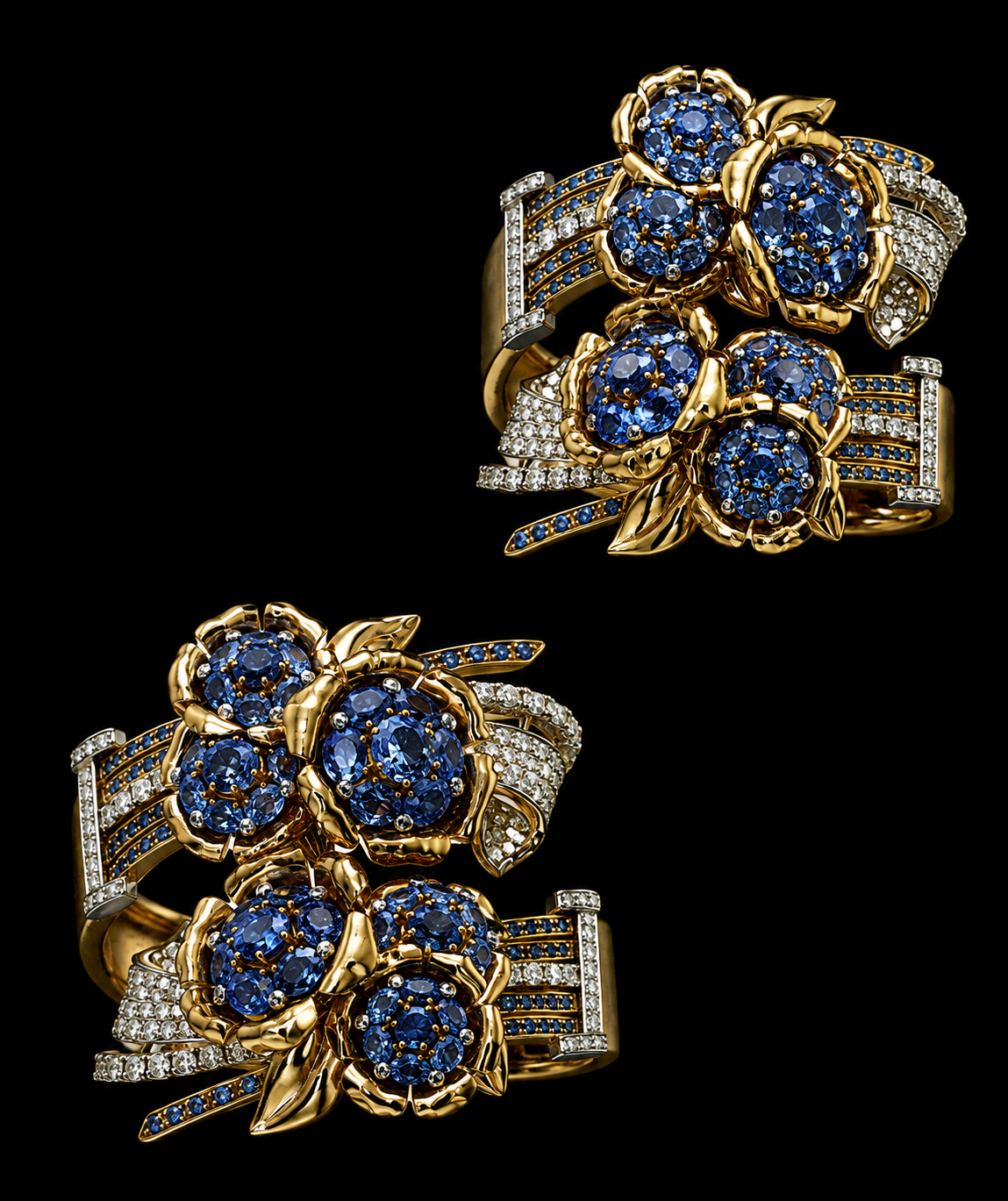 Deux bracelets en or, ornés de pierres précieuses bleues et de diamants, avec un motif floral et des détails incrustés de diamants, sur un fond noir.