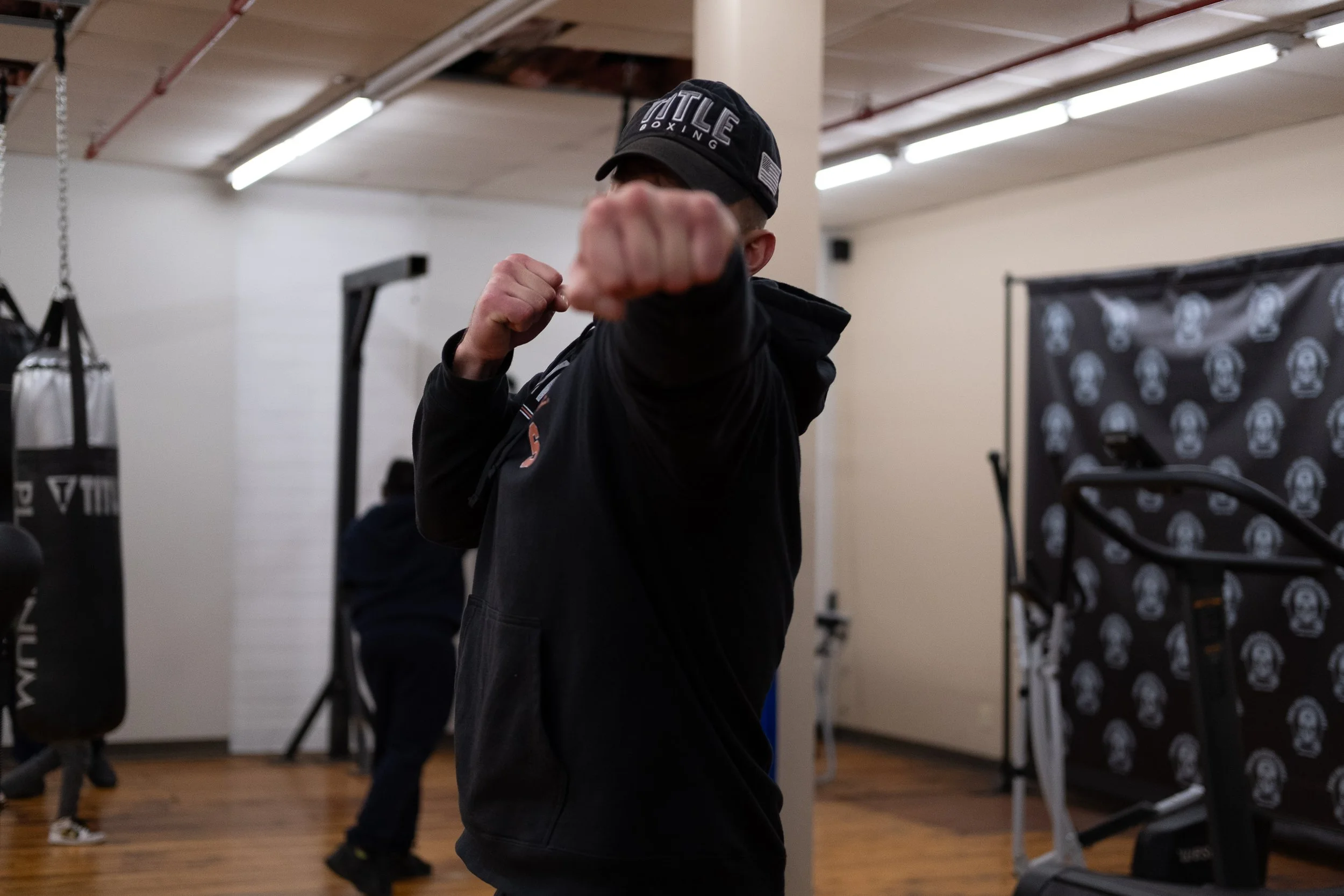  Coach Joe Stray sticks his fist out toward the camera. Photo by Rabia Mustafa. 