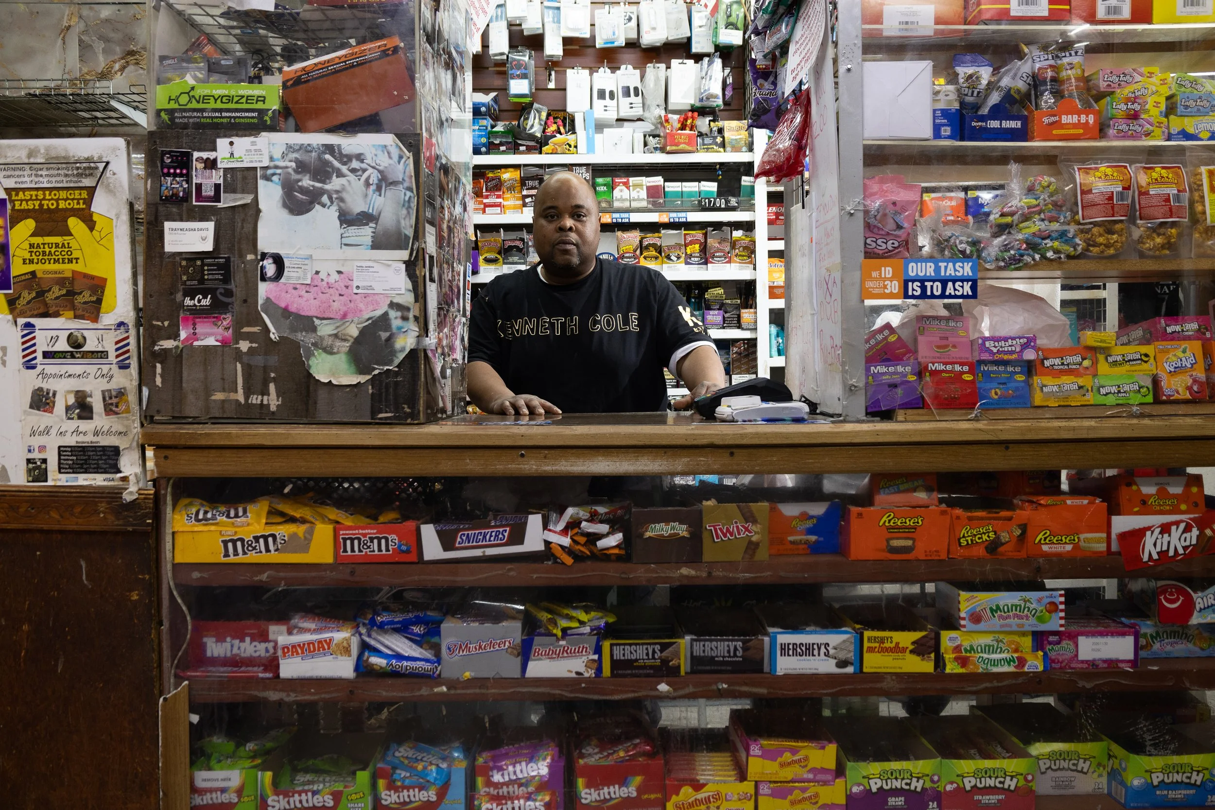 Kelvin Jackson stands behind the counter at Ze Mart, a convenience store on Syracuse's South Side, on Jan. 10, 2026. Photo by: Destinyi Fernandez 