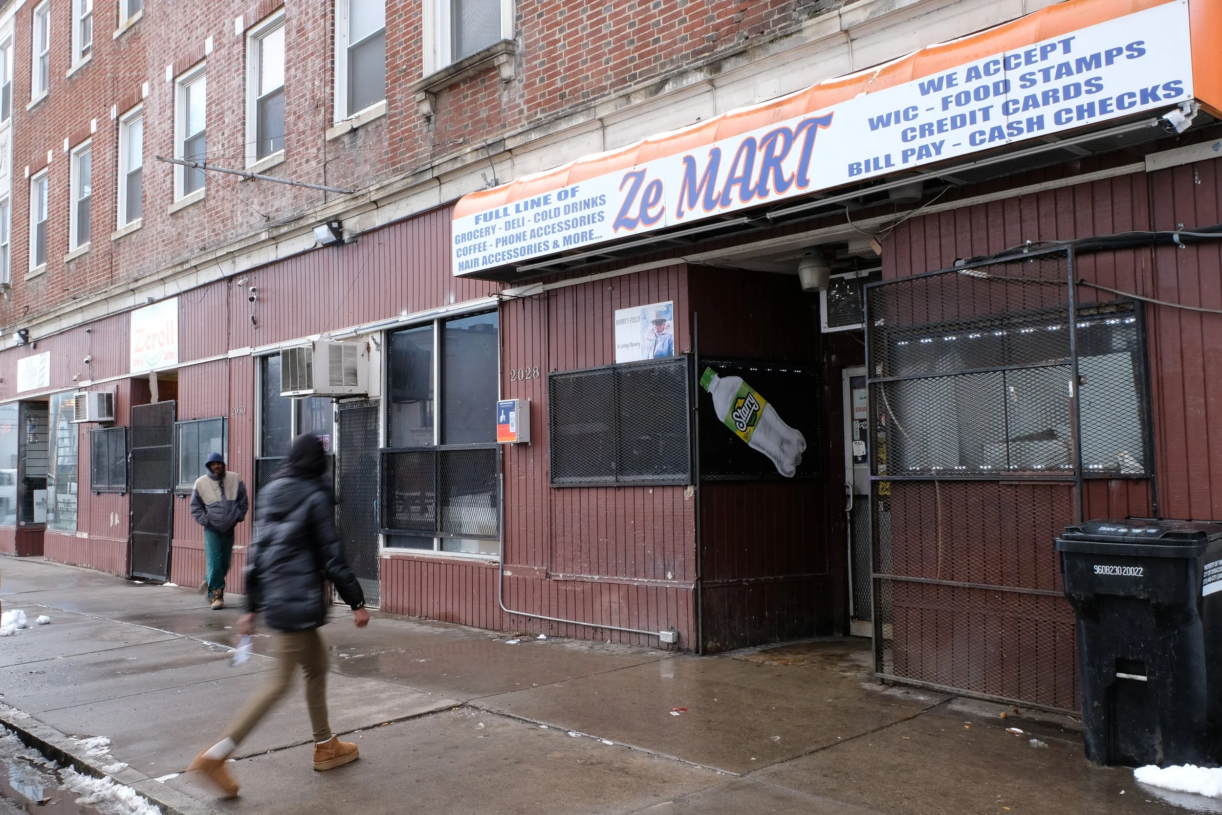  A pedestrian crosses South Salina Street toward Ze Mart on a  cold rainy morning in Syracuse, N.Y., on Jan. 17, 2026. Photo by: Micah Orieta 