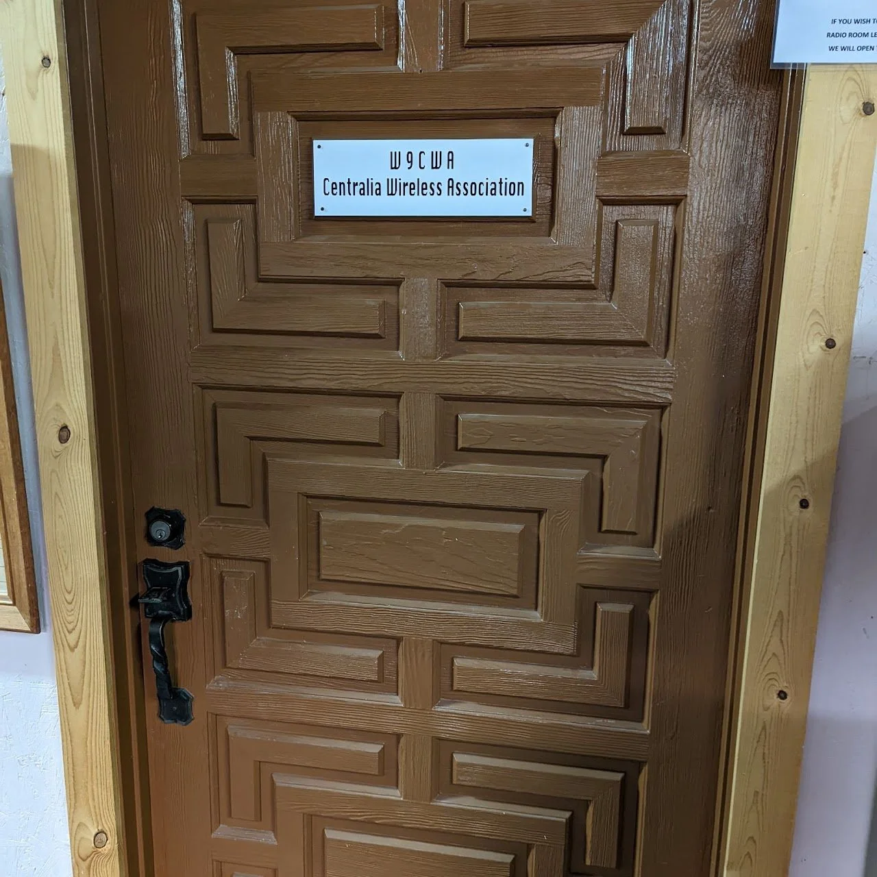 Wooden door with sign that reads 'WCGWA Centralia Wireless Association'.