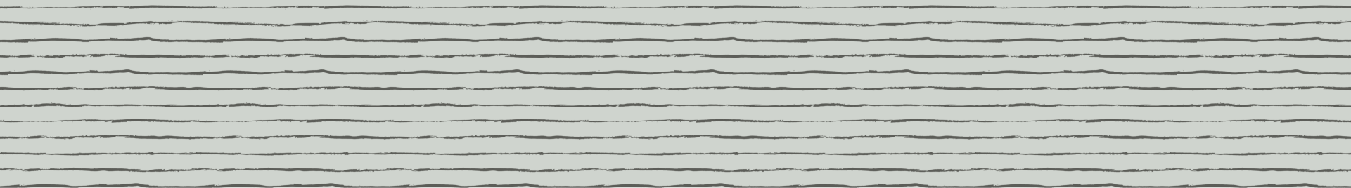 Close-up of whitewood planks with dark knots and light grain lines.