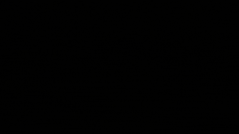 A black background with a faint glow in the center.