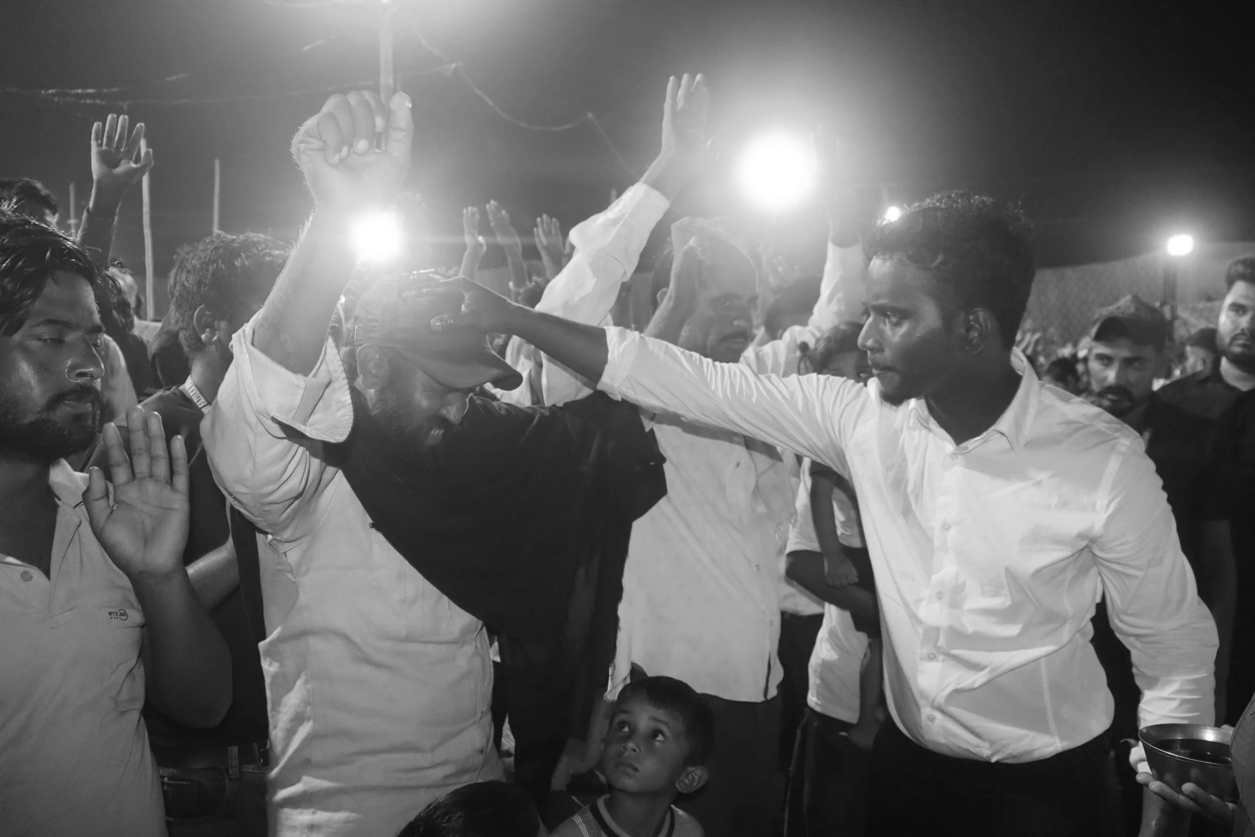 Evangelist Sunny Laying Hands and Praying