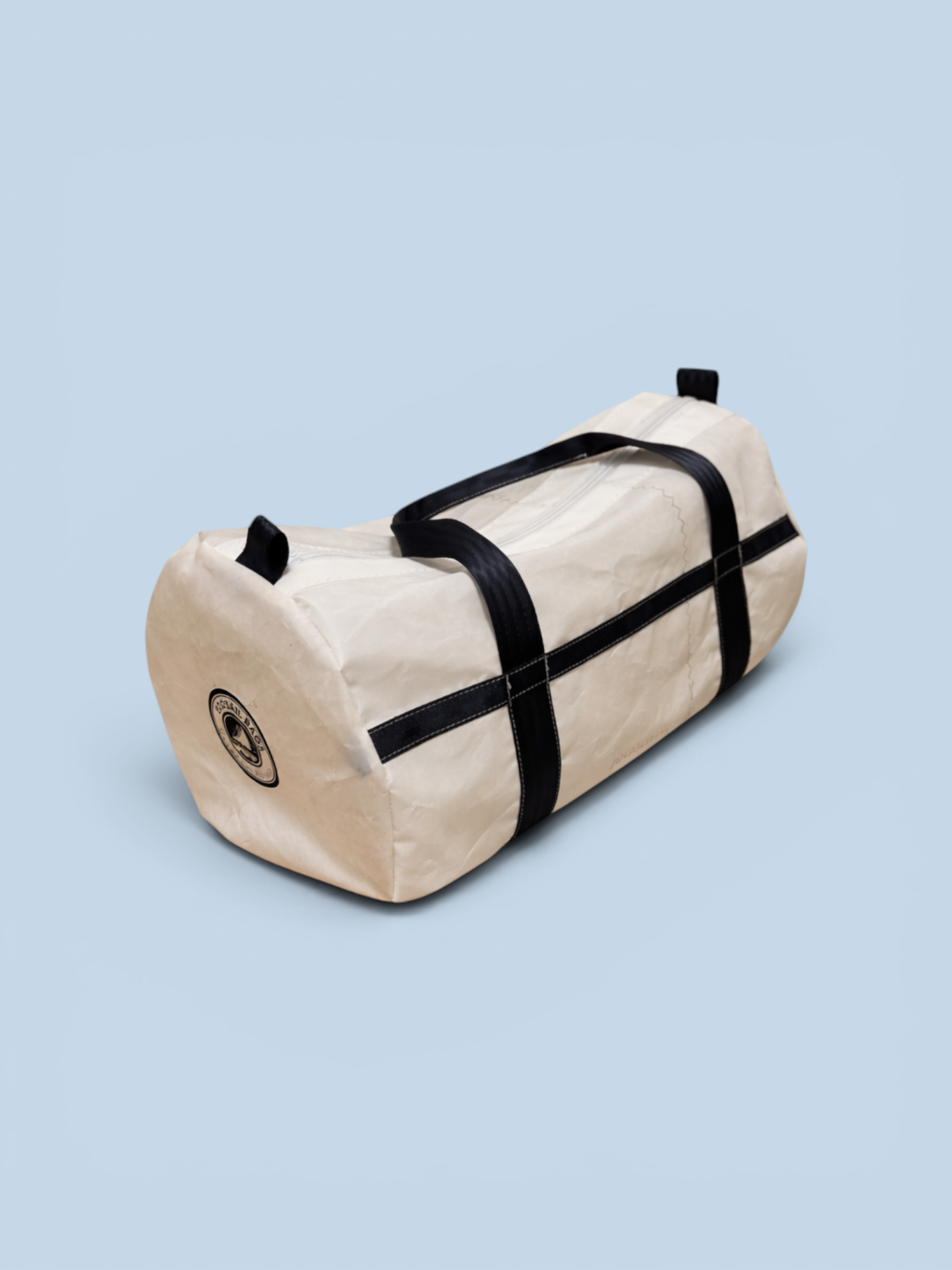 Sailcloth duffel bag with navy straps.png