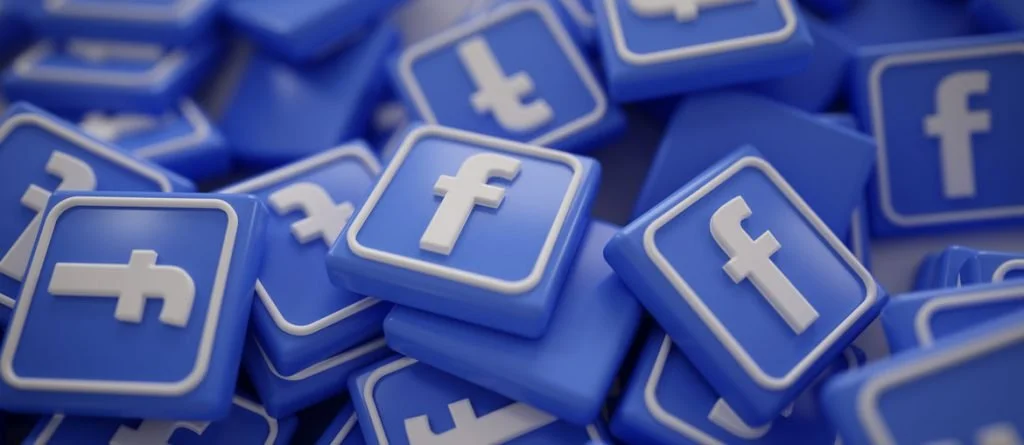 A pile of blue Facebook logo icons with white 'f' in the center.