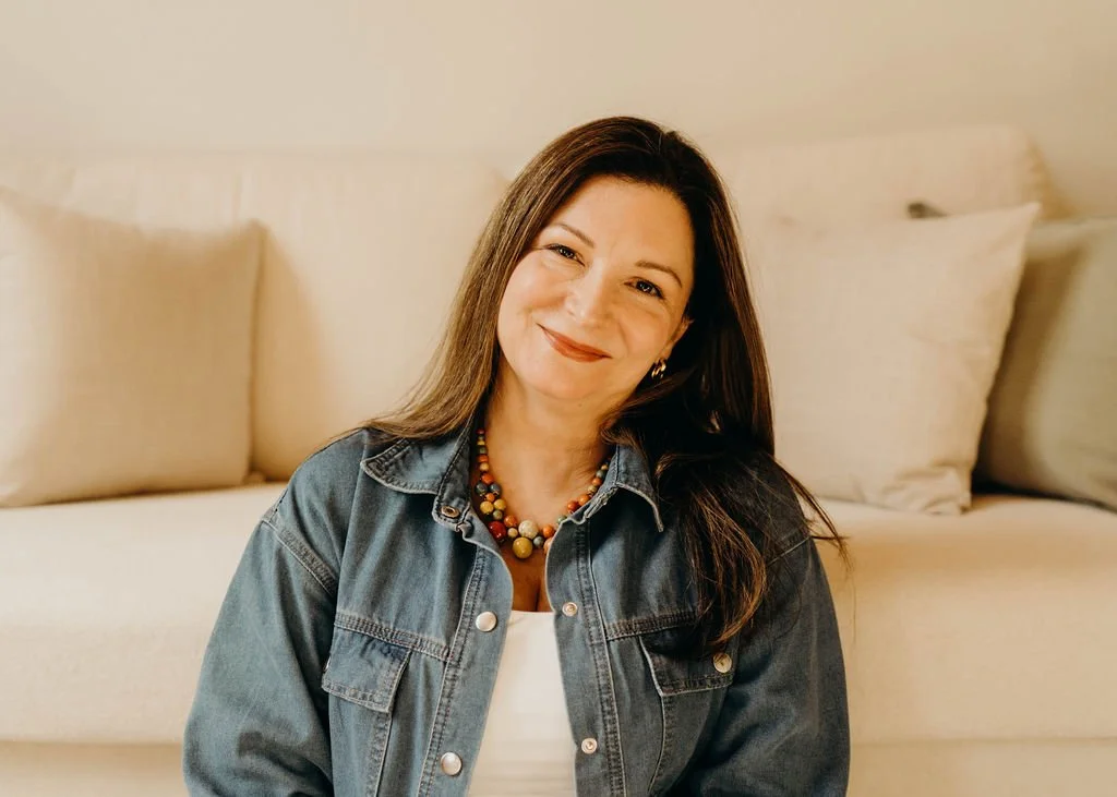 Headshot of Kristie LaRocca, Energy Healer and Medium, smiling in her office