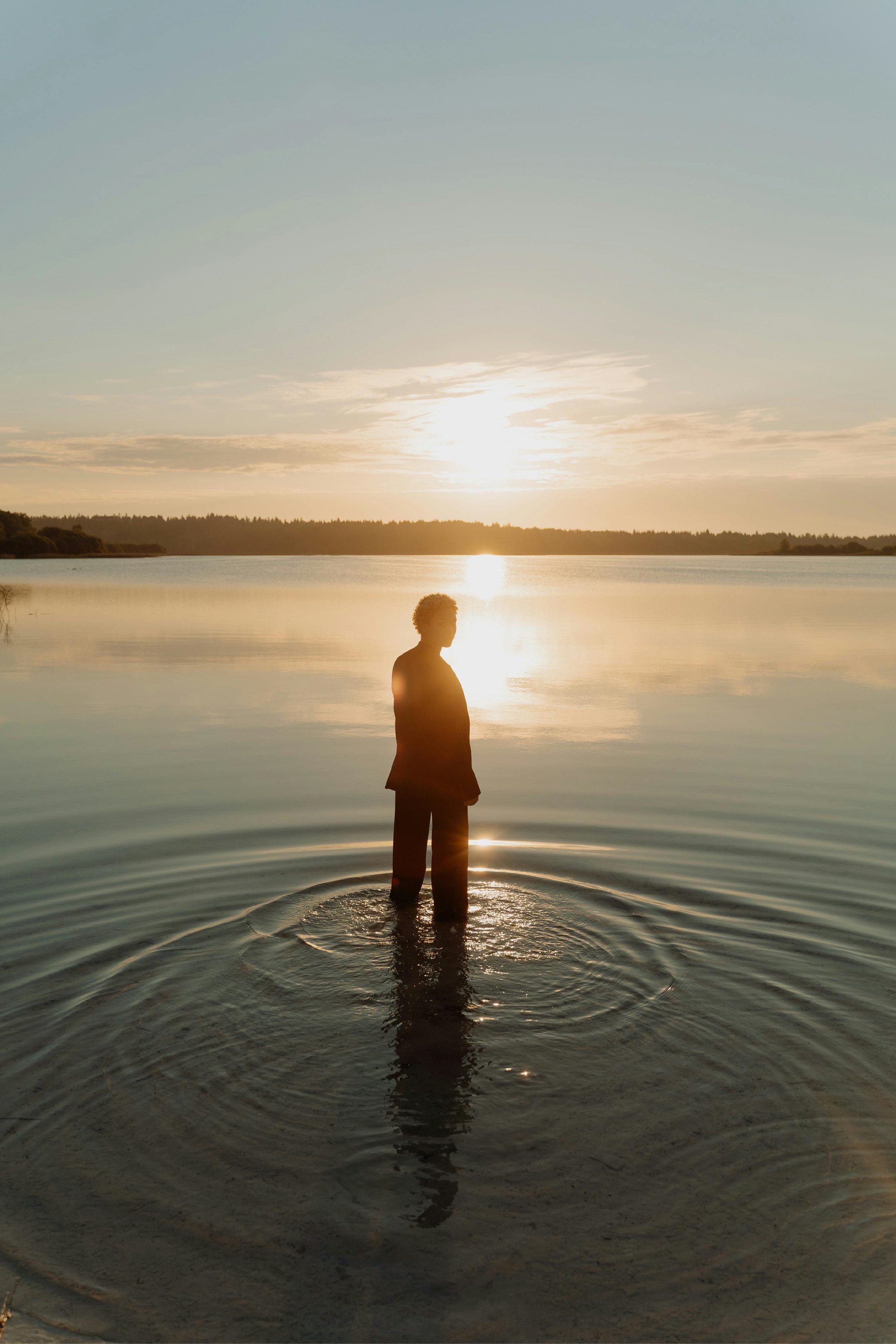 Woman standing in the water during an energy healing session with Kristie LaRocca