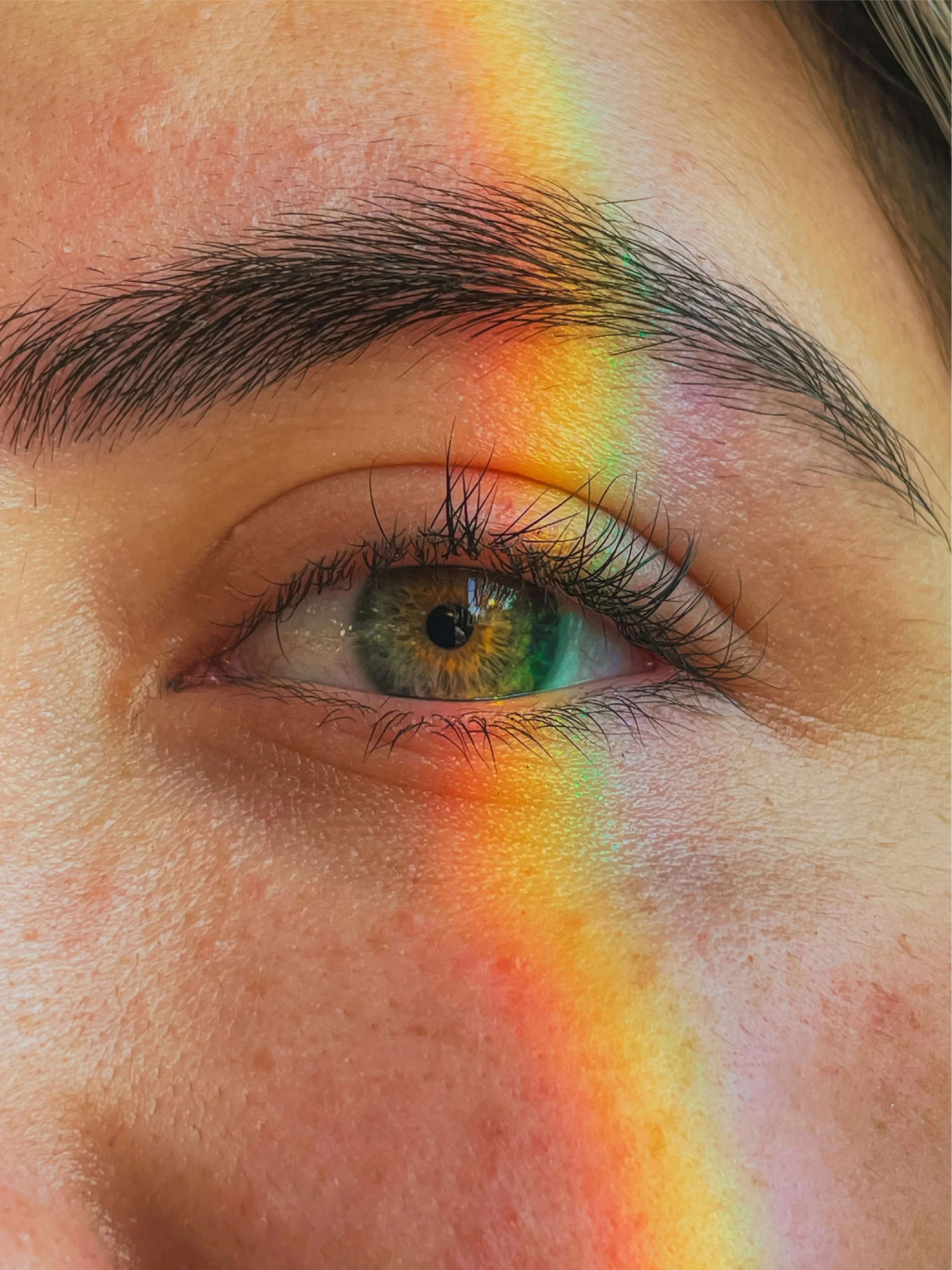 Girl with rainbow on her face after an intuitive reading with Kristie LaRocca
