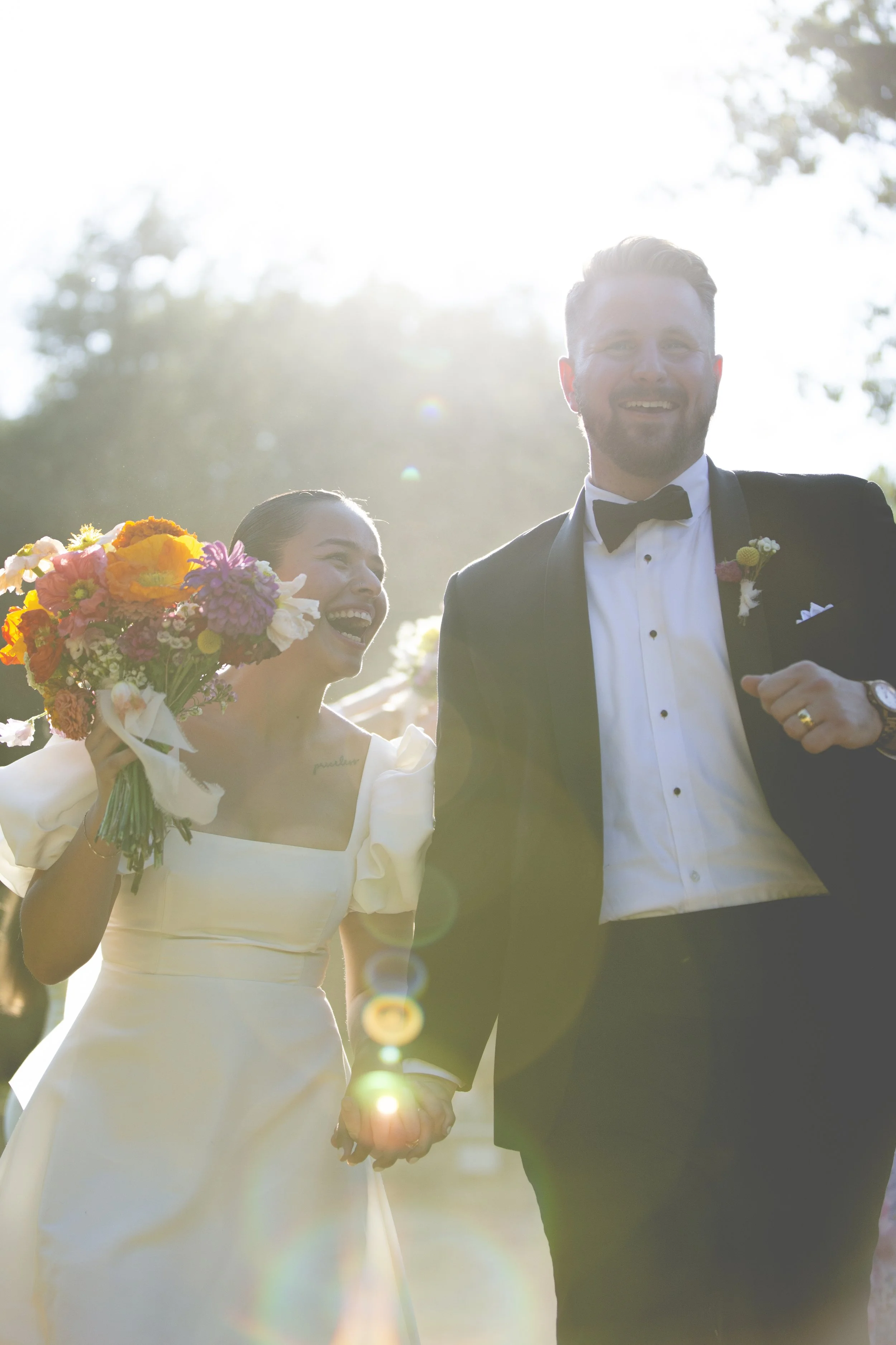 Joyful couple on their wedding day at Clark Gardens
