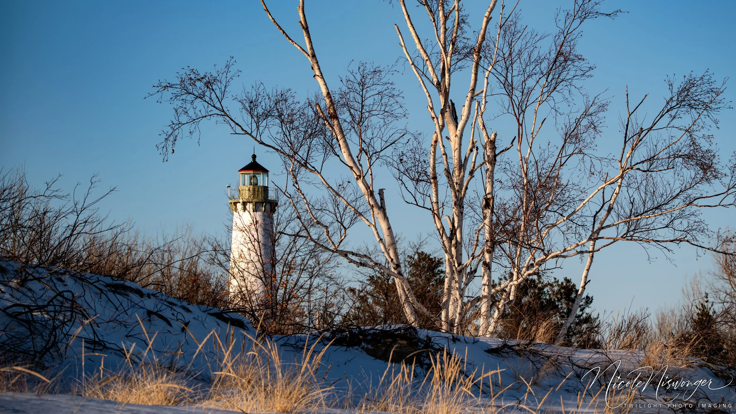 Golden hour glow on Tawas Point Lighthouse in February 2026.
