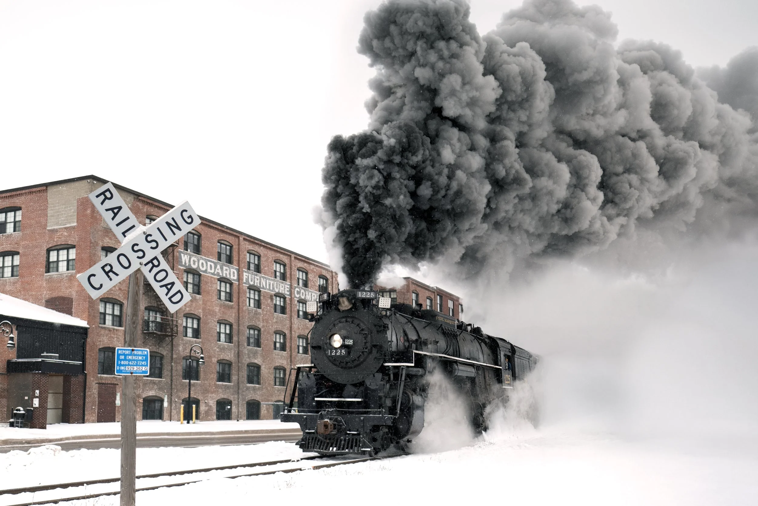 Pere Marquette 1225 passing the Woodard Station in December 2025.