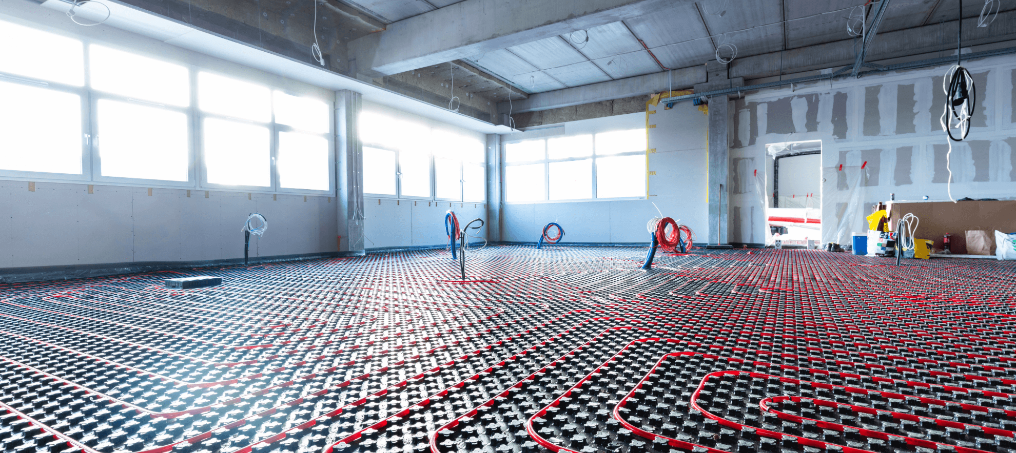 Underfloor heating being installed in an office