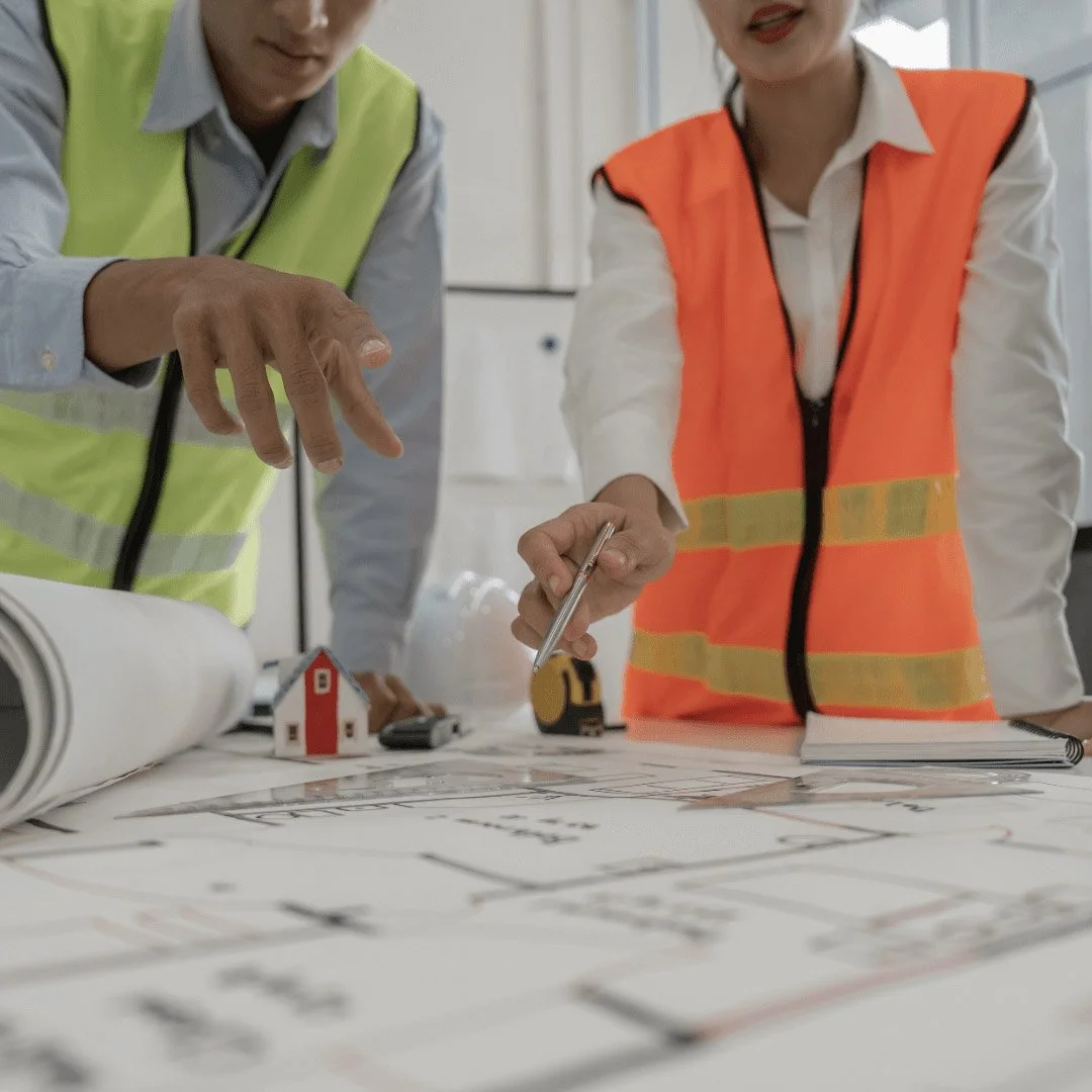 2 people reviewing plans for a property development