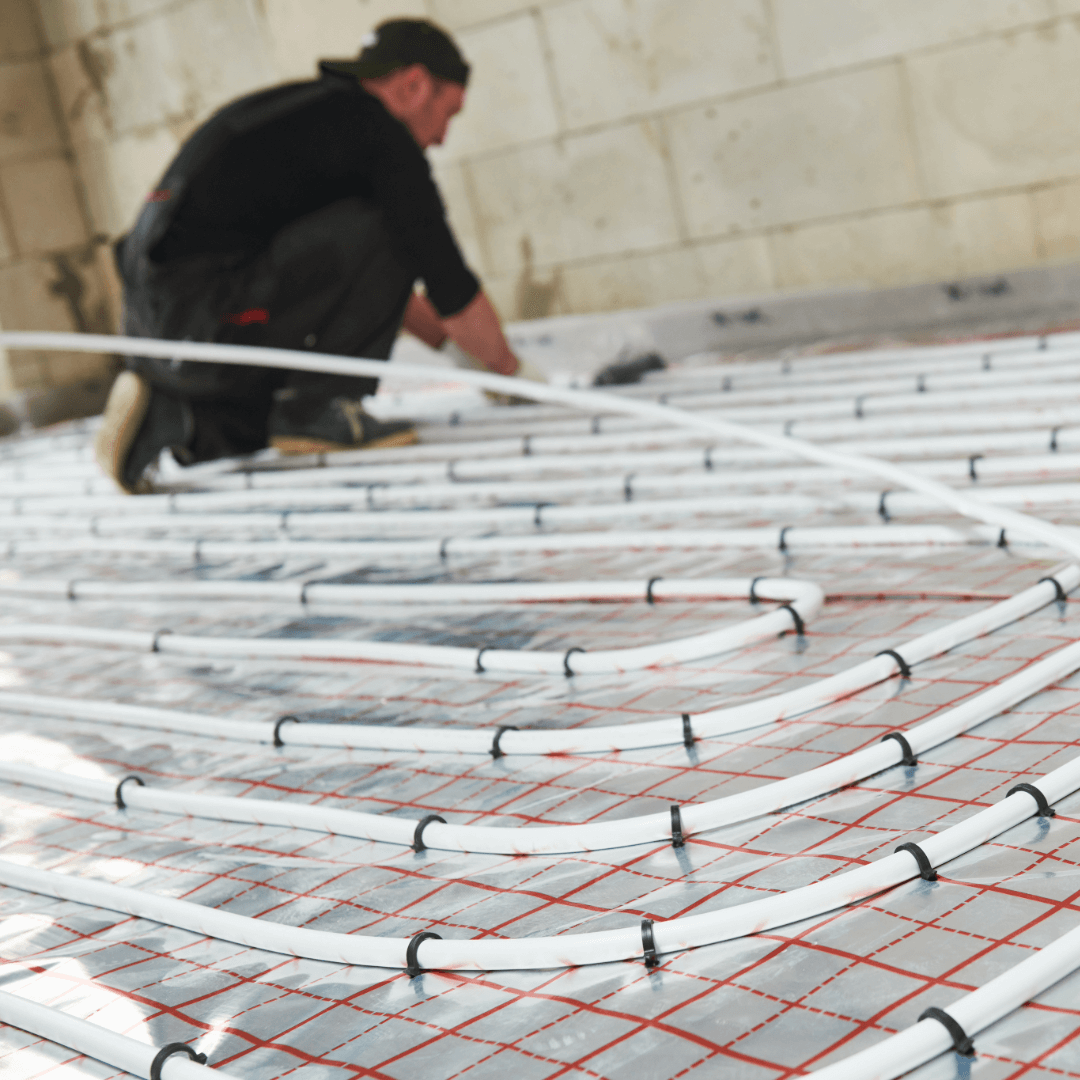 underfloor heating being installed as part of an energy efficient heating system for a residential property development