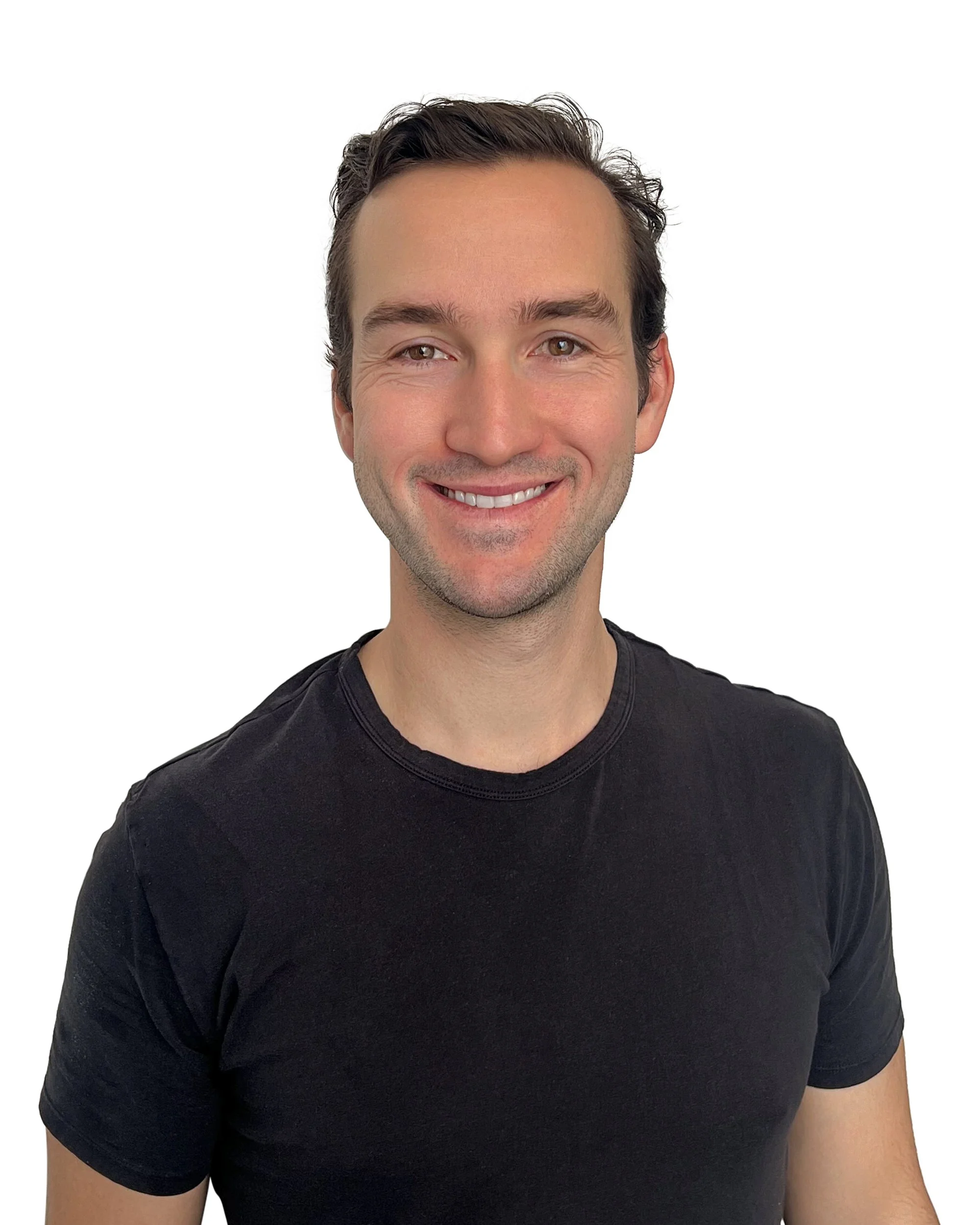 A smiling man with short dark hair wearing a black t-shirt, standing against a plain white background.