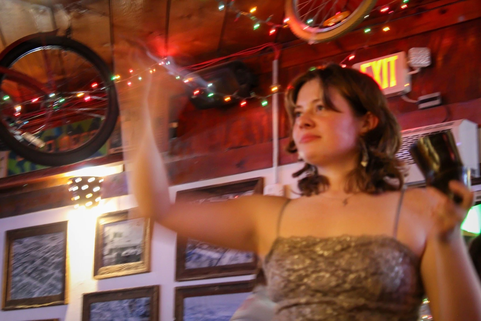 Darts at Lou’s - 
University of North Texas Senior Kat Hardy plays darts with her friends at Lucky Lou's Pint Night on Tuesday, Apr. 28, 2026. (photo by Genevieve Kaufmann)