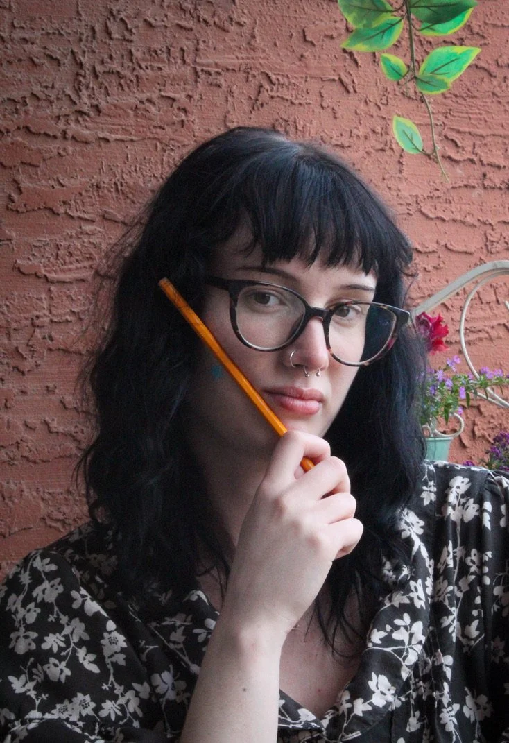 University of North Texas Senior Kat Lane poses with her 'school pencil' on her balcony in Denton, Texas on Thursday, April 9, 2026. Lane is an Education Major and wants to teach middle school history after graduating. (photo by Genevieve Kaufmann)
I