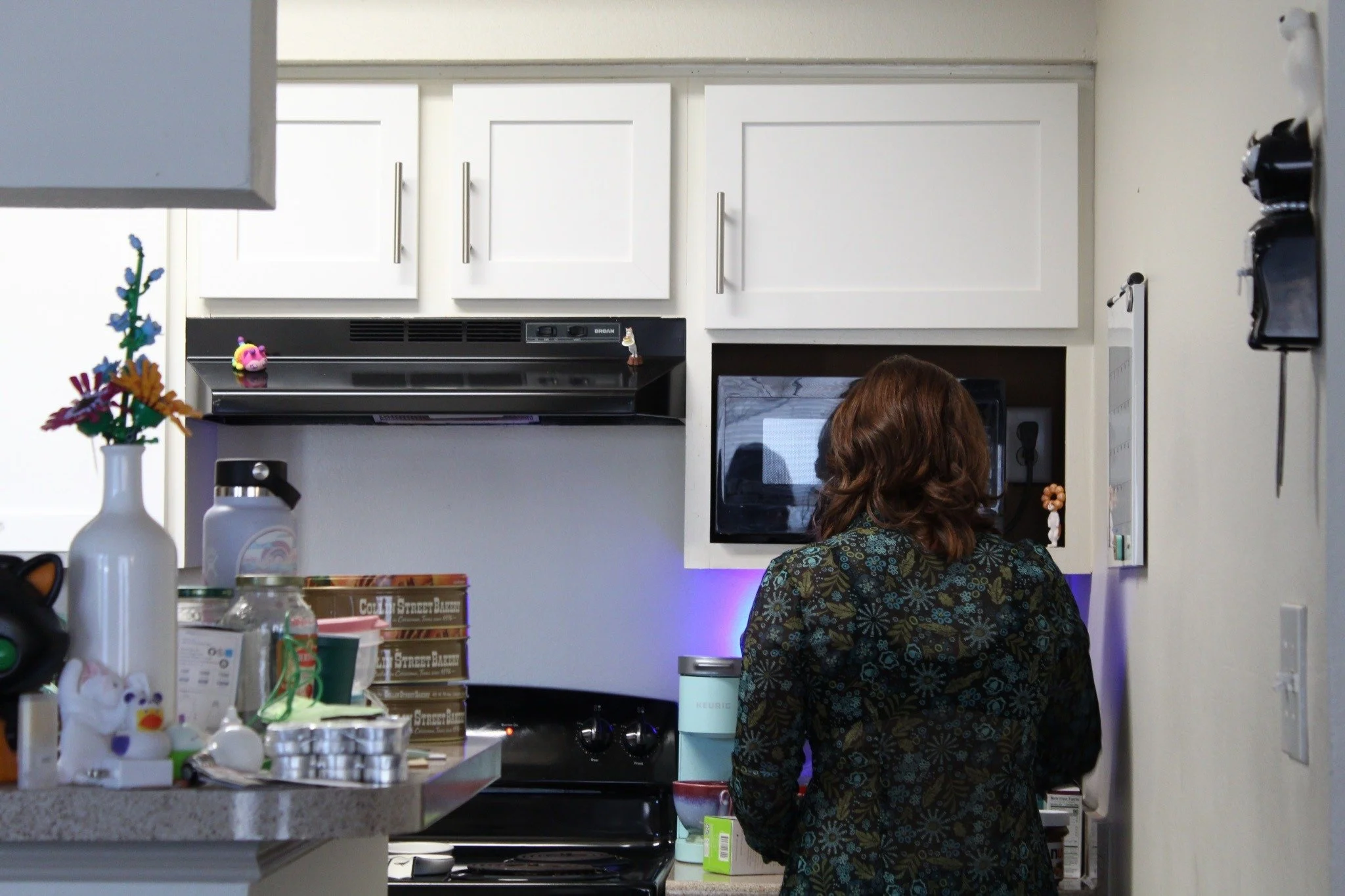Waking Up - 22-year-old Kat Hardy makes green tea in her kitchen on Saturday, May 2, 2026. Hardy likes to take a moment each morning to be by herself before starting her hectic day. (photo by Genevieve Kaufmann)