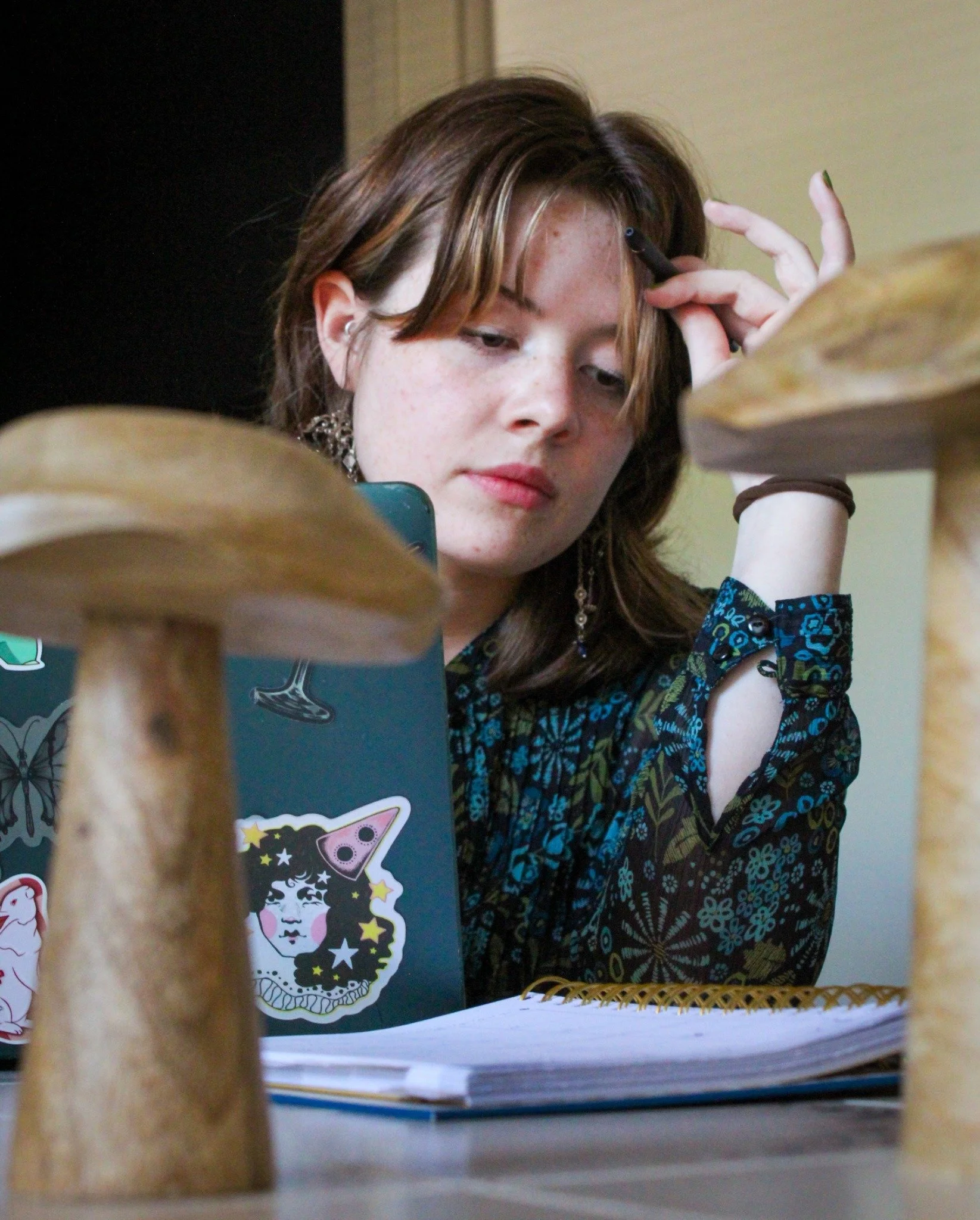 Working Nonstop - University of North Texas Senior Kat Hardy sits at her apartment table while finishing work in Denton on Saturday, May 2, 2026. Hardy works 30 hours a week outside of school and extracurriculars. (photo by Genevieve Kaufmann)