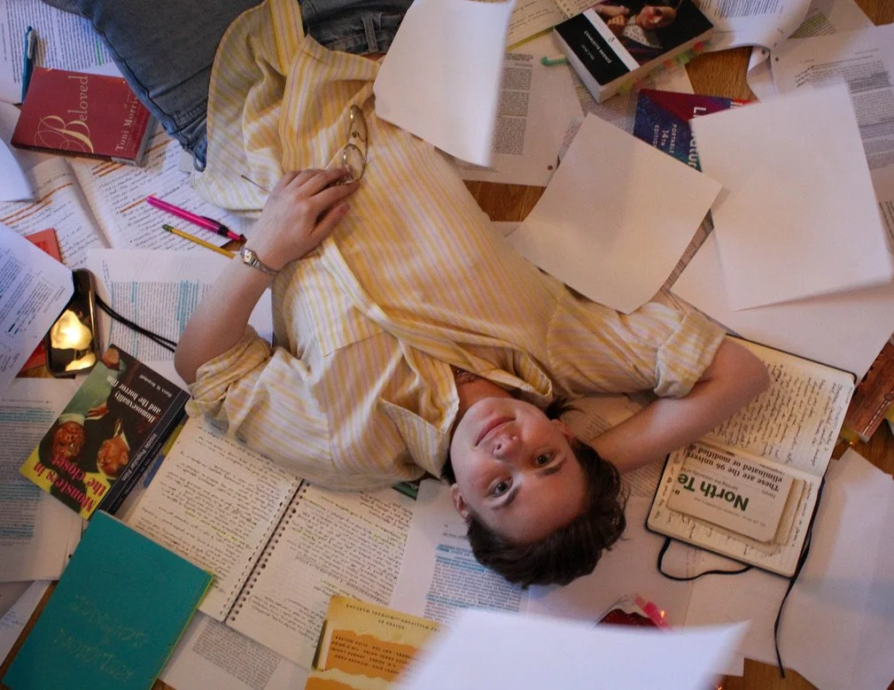 University of North Texas Senior Cricket Wier poses surrounded by her notes in her apartment in Denton, Texas on Wednesday, April 8, 2026. Wier is an English and Philosophy Major and wants to get her Bachelor's after graduation. (photo by Genevieve K