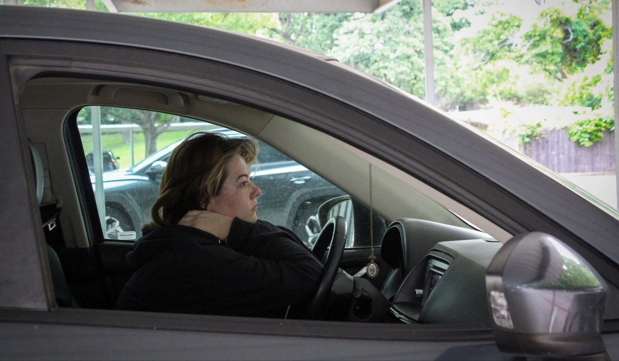 Early Morning Contemplations - University of North Texas Senior Kat Hardy sits in her car after a long night at her ceramics studio in Denton on Tuesday, May 5, 2026. Hardy usually spends almost all night in the studio during project weeks. (photo by