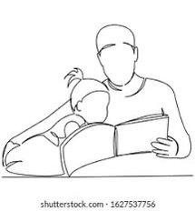 A person reading a book to a child, both sitting at a table.