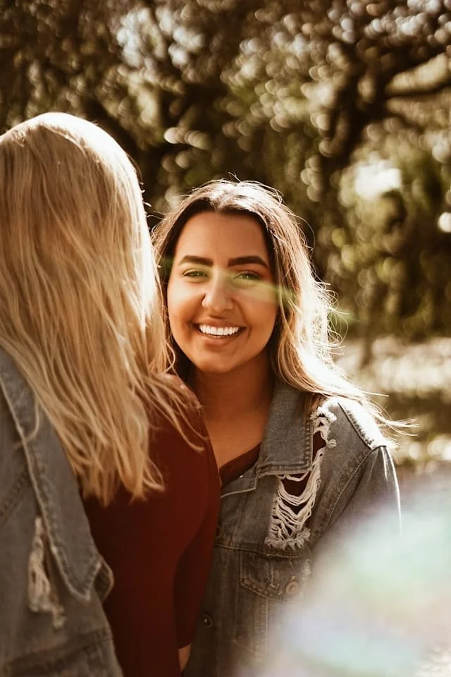 A woman smiling in a group of friends