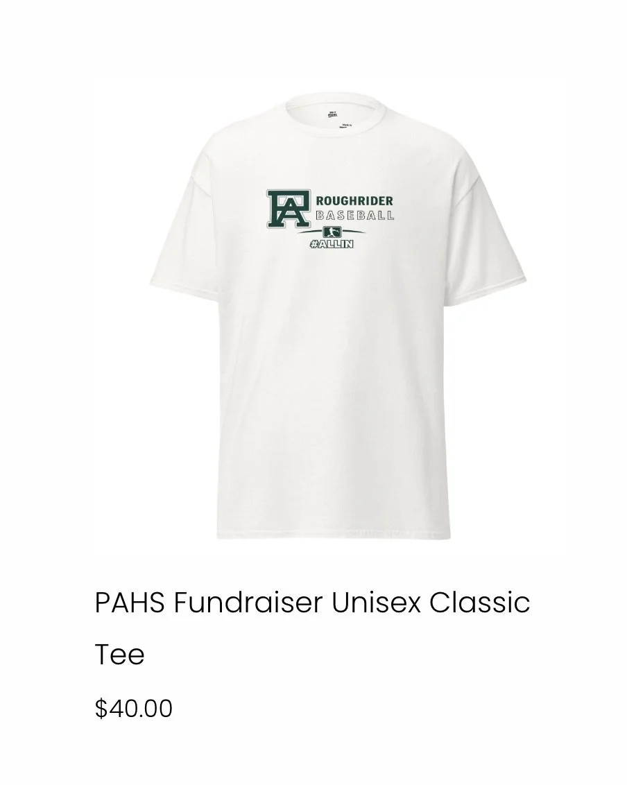 White unisex t-shirt featuring a graphic with the text 'Roughrider Baseball' and a hashtag '#ALLIN'.