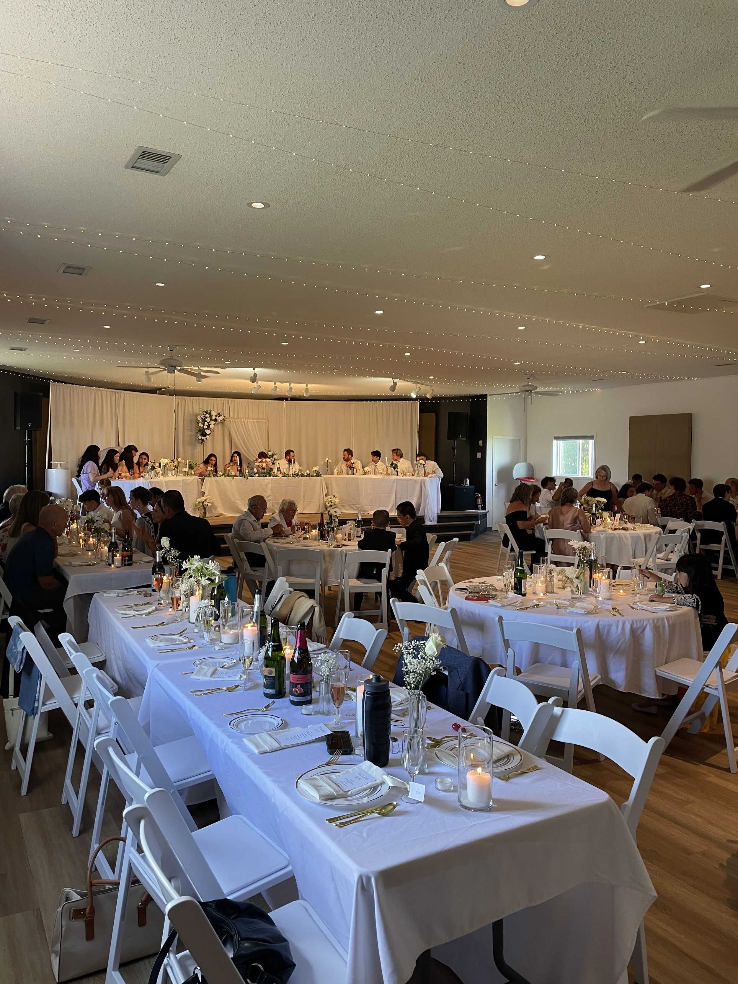 Reception set up in the auditorium at Open Country Farm Event Centre, seating for up to 120 guests, near Calgary Alberta