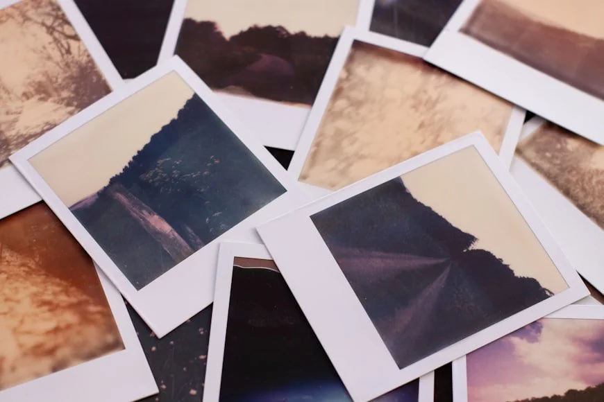 Scattered photographs representing the cost of unresolved trauma