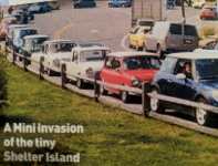 Row of parked cars on a grassy area