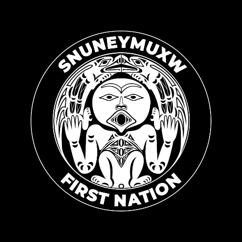 A black circular emblem with a central drawing of a stylized human figure with large eyes, open mouth, and tribal patterns. The figure has four arms with hands raised, and two legs. Surrounding the figure are tribal animal motifs. The top of the circle reads "SNUNUNEMUXW" and the bottom reads "FIRST NATION."