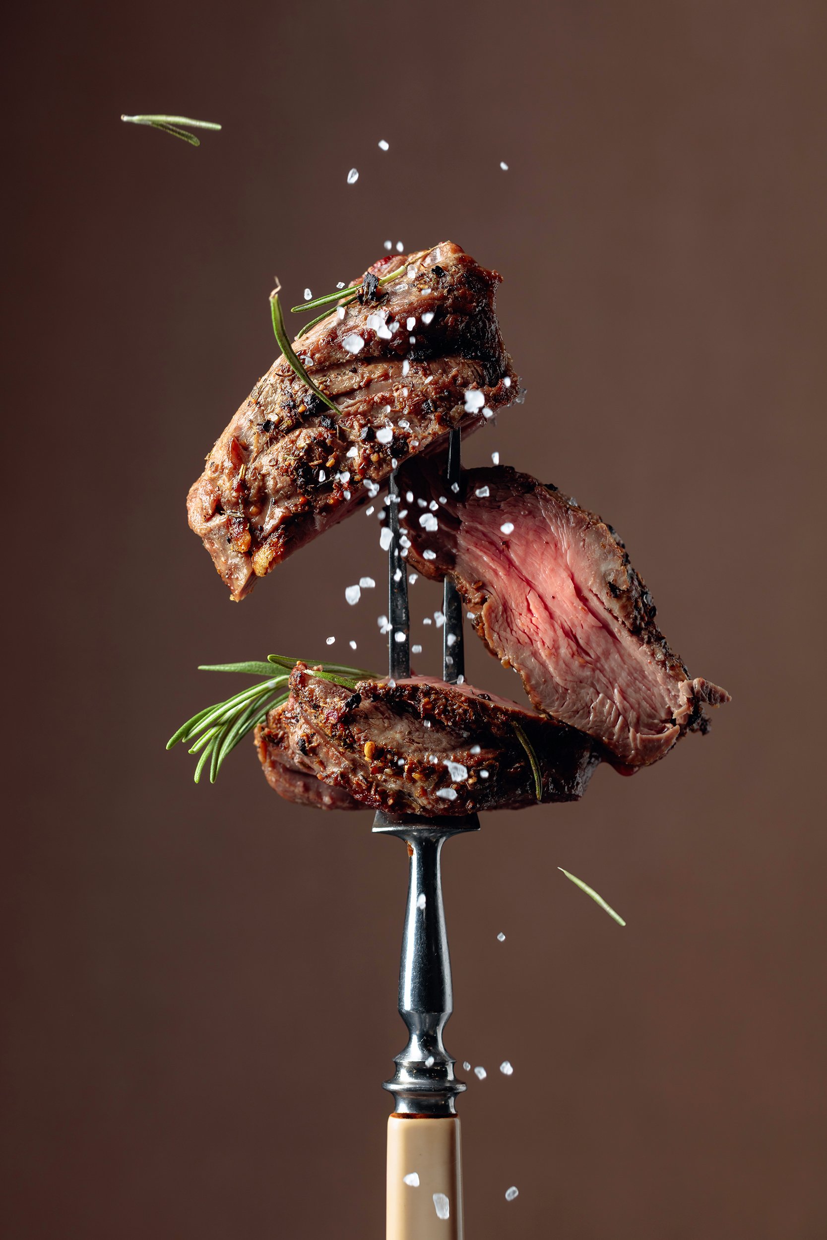 Cuts of steak on a meat fork - Dickenson's Quality Meats of Fulham