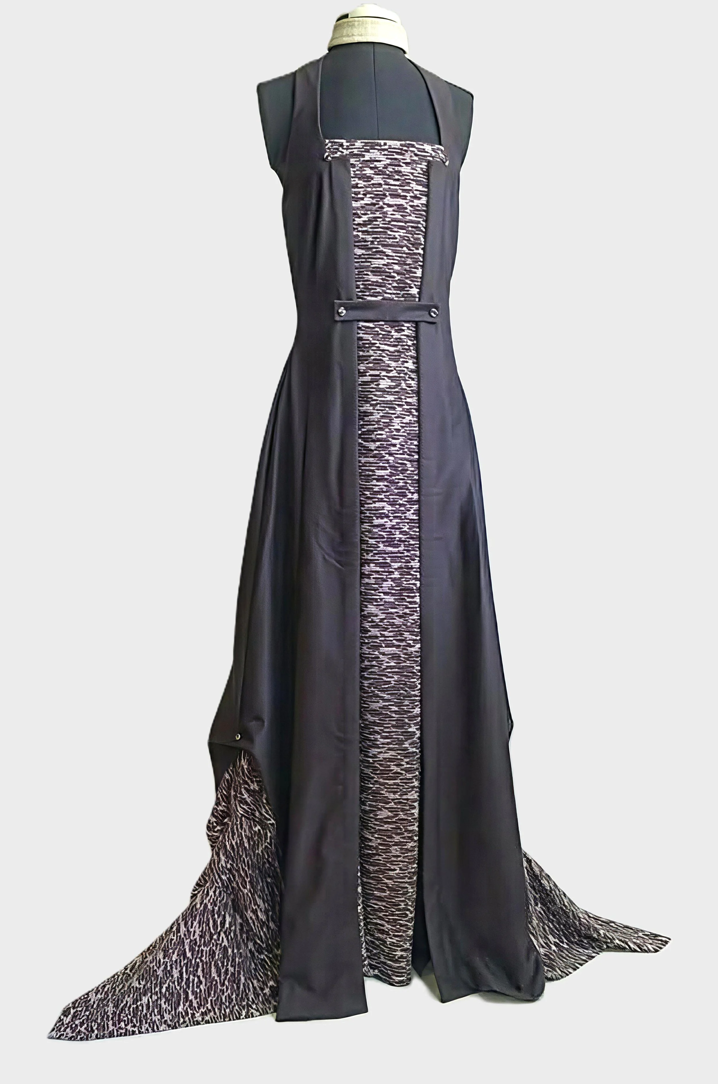 Vintage inspired, long dark lavender sleeveless gown with textured panels and accents. Side slits with underneath layer showing through. Belted as an overdress appearance.