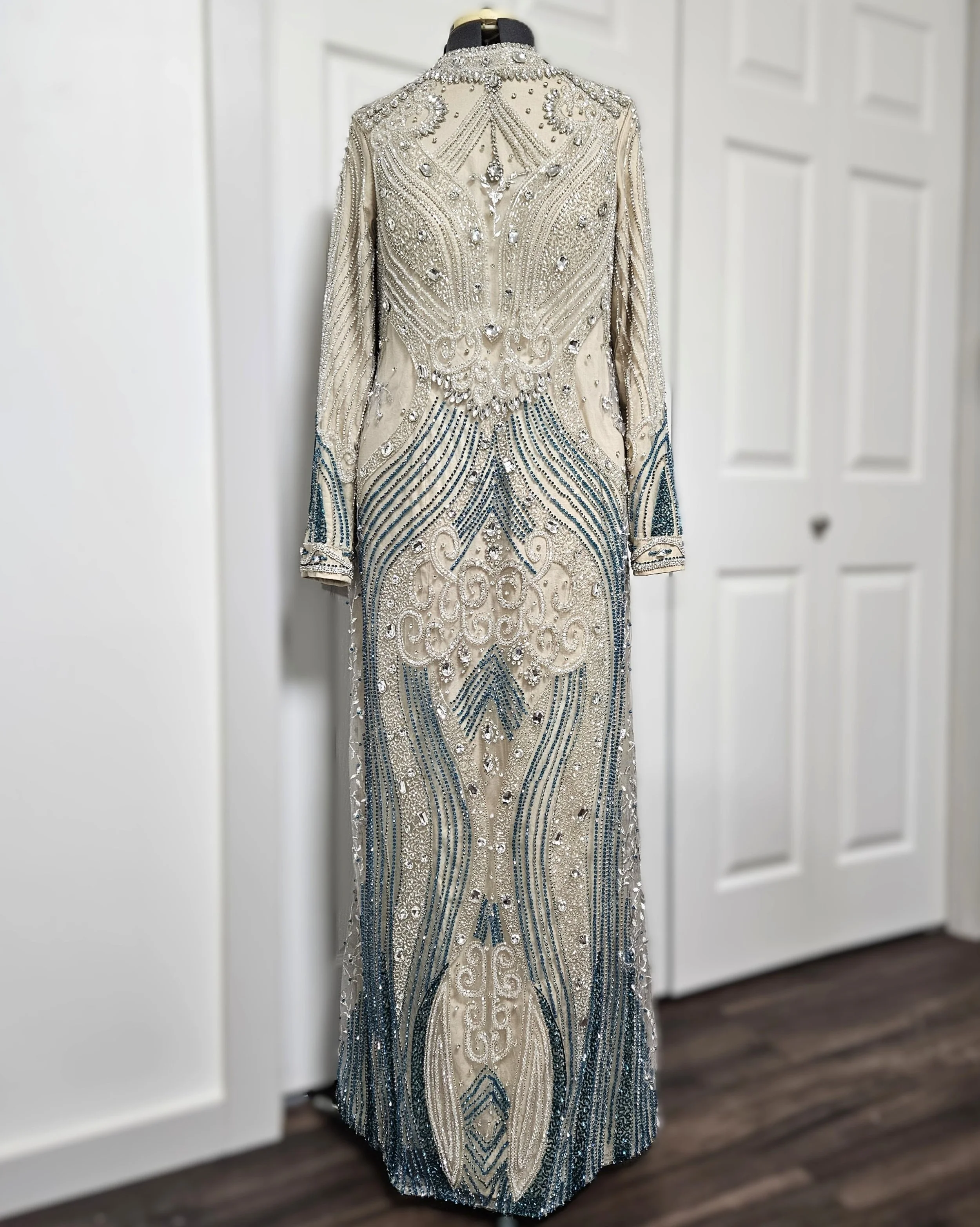 Custom anniversary dress designed using Clo3D and developed through digital patternmaking for a precise, body-specific fit. Constructed from pre-beaded mesh with additional hand-applied embellishments, carefully integrated to maintain the original de