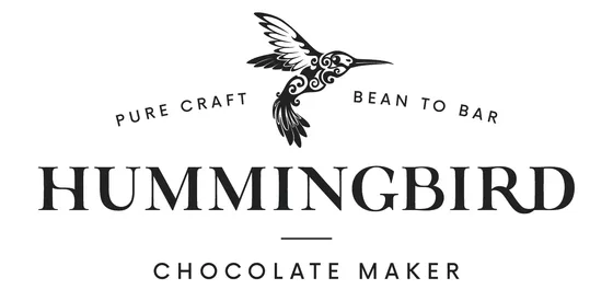 Logo featuring a hummingbird and the text 'Pure Craft Bean to Bar Hummingbird Chocolate Maker'