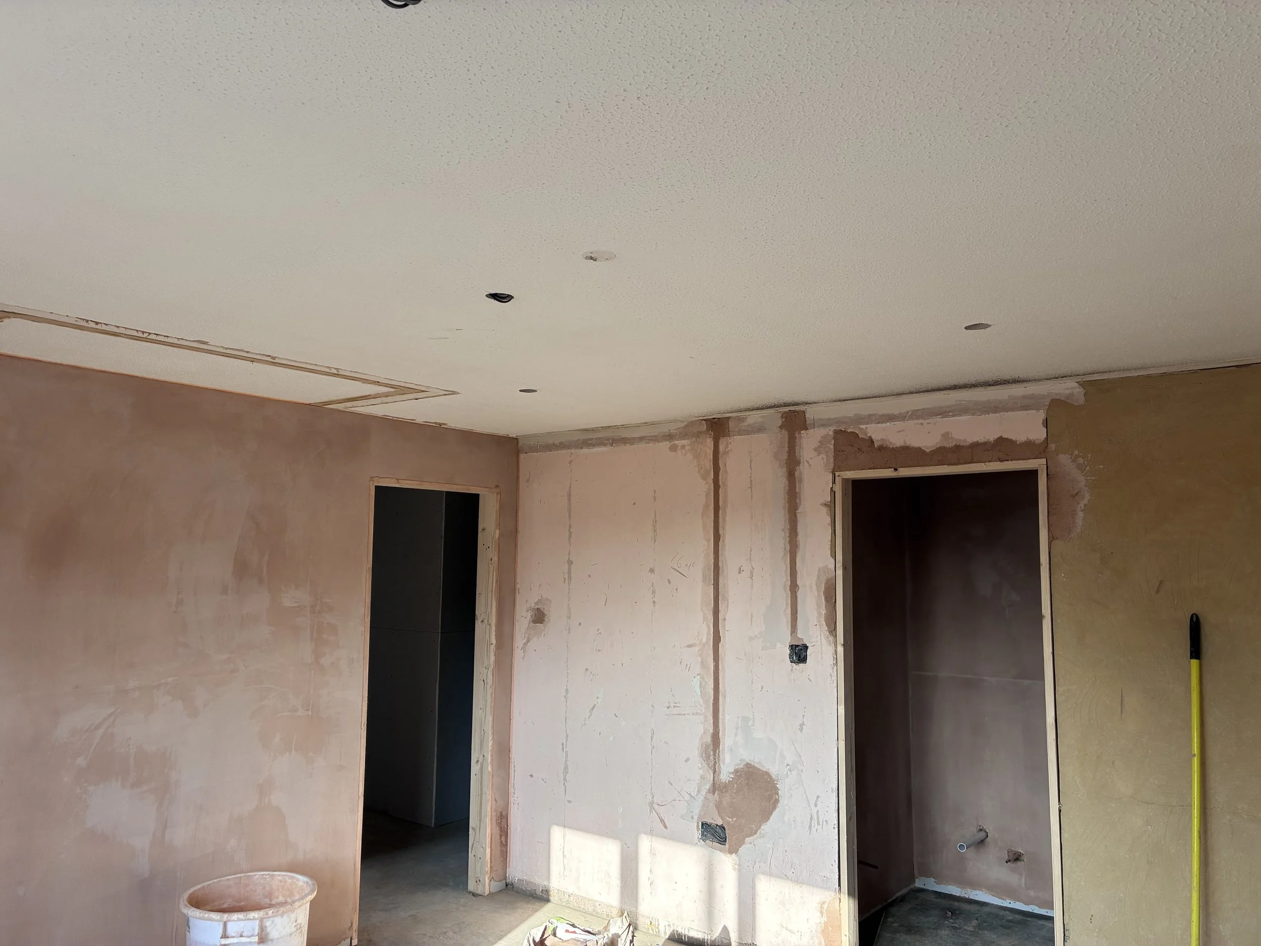 Room prepared for over skimming by A. Nicholls Plastering during a four-bedroom bungalow renovation in St Neots.