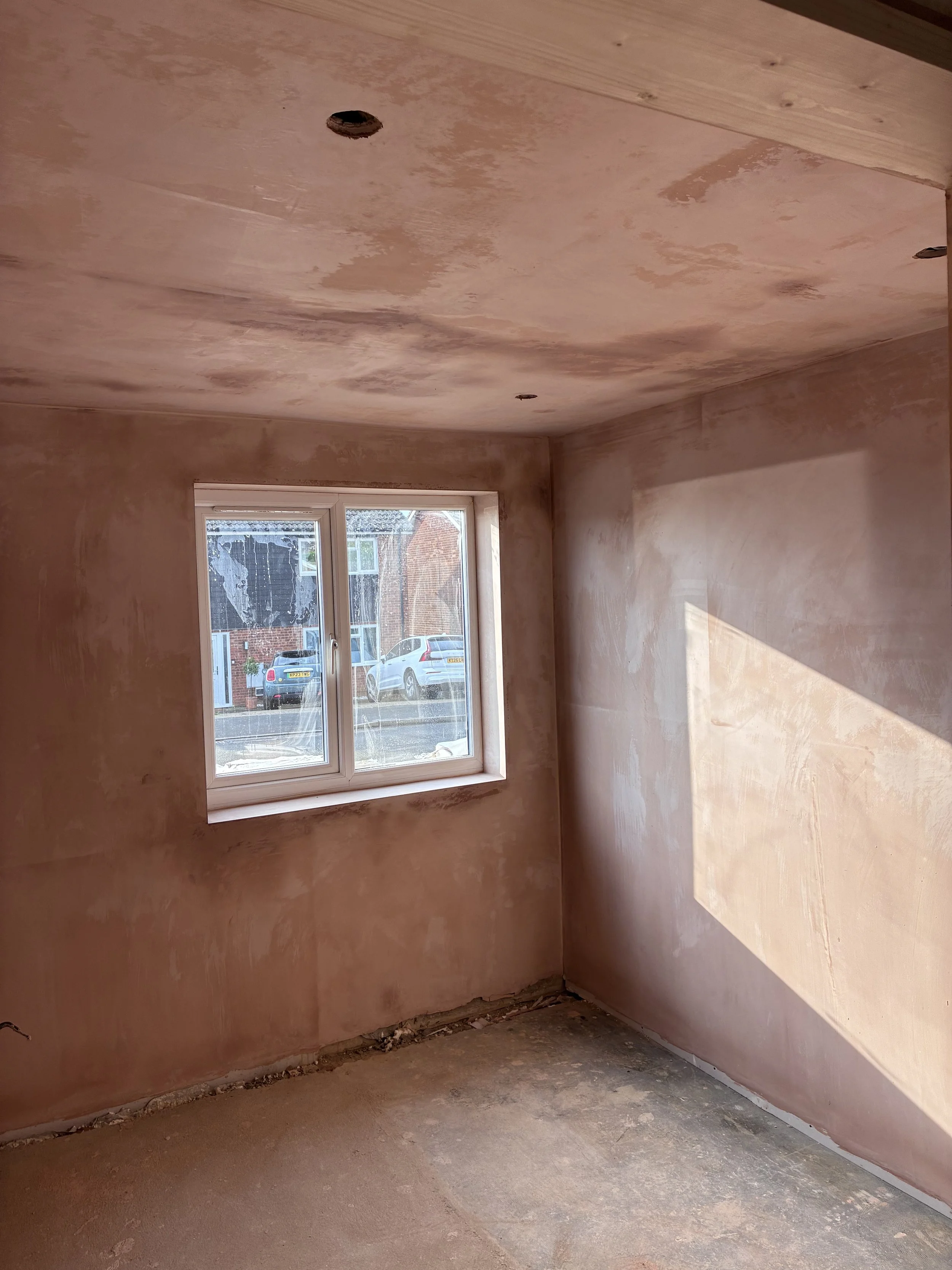 Newly plastered bedroom with smooth skimmed walls ready for decorating in a renovated St Neots bungalow.