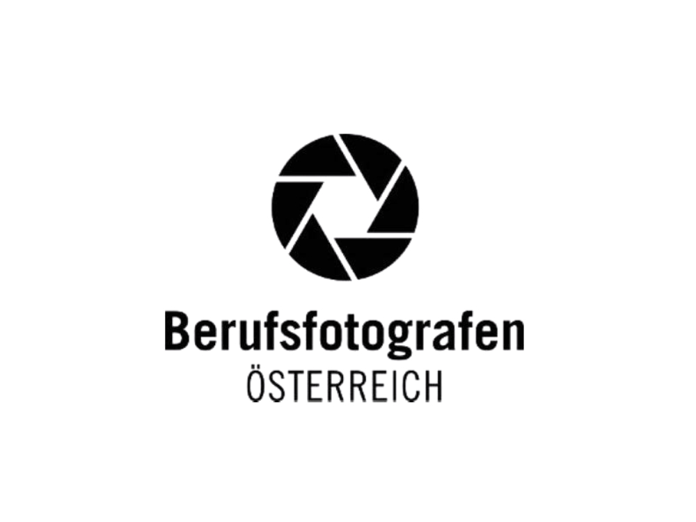 Logo mit einem schwarzen Kamerablenden-Symbol und dem Text 'Berufsfotografen Österreich' darunter.