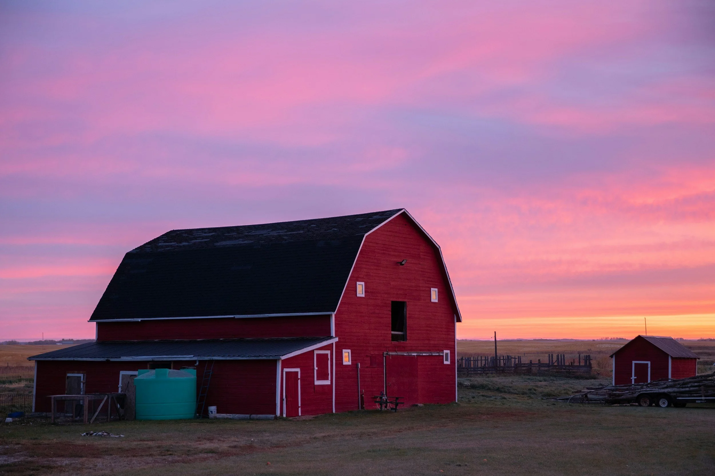 red hay barn to store plastic hay rings for horses