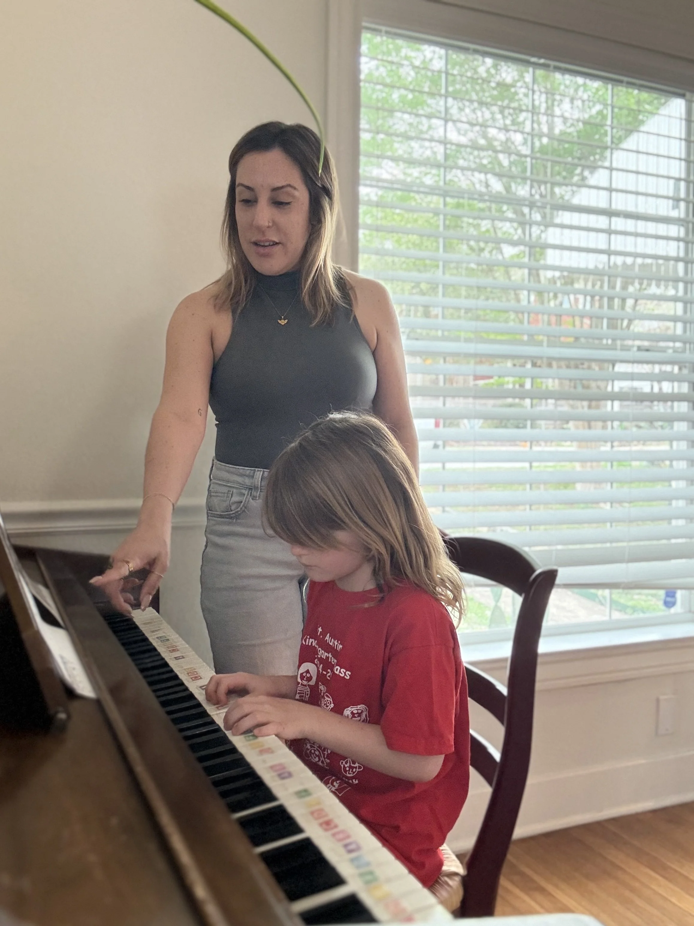 Alex and young female student at home piano lesson in Austin.