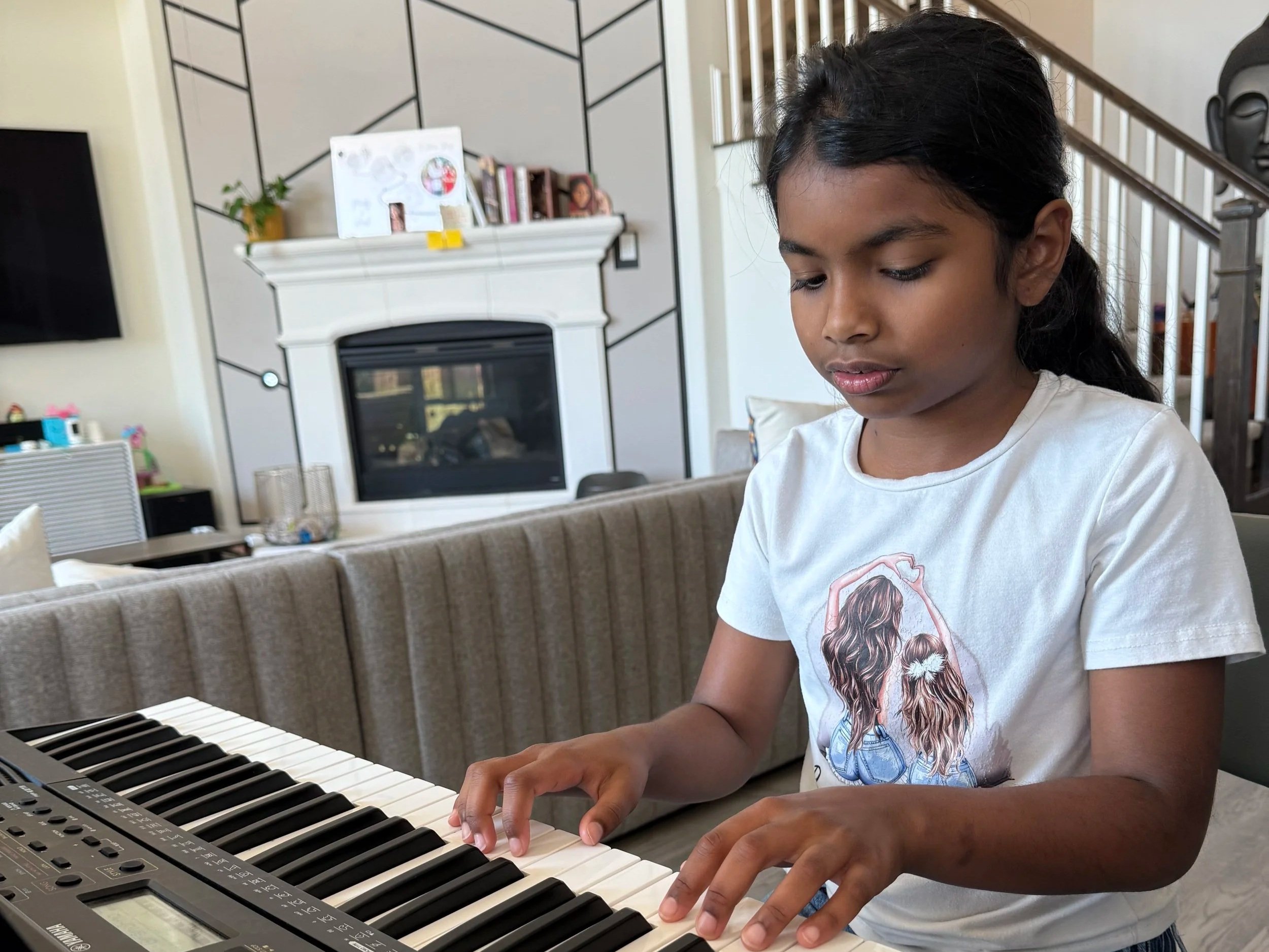Avishi practicing piano at home in Cedar Park.