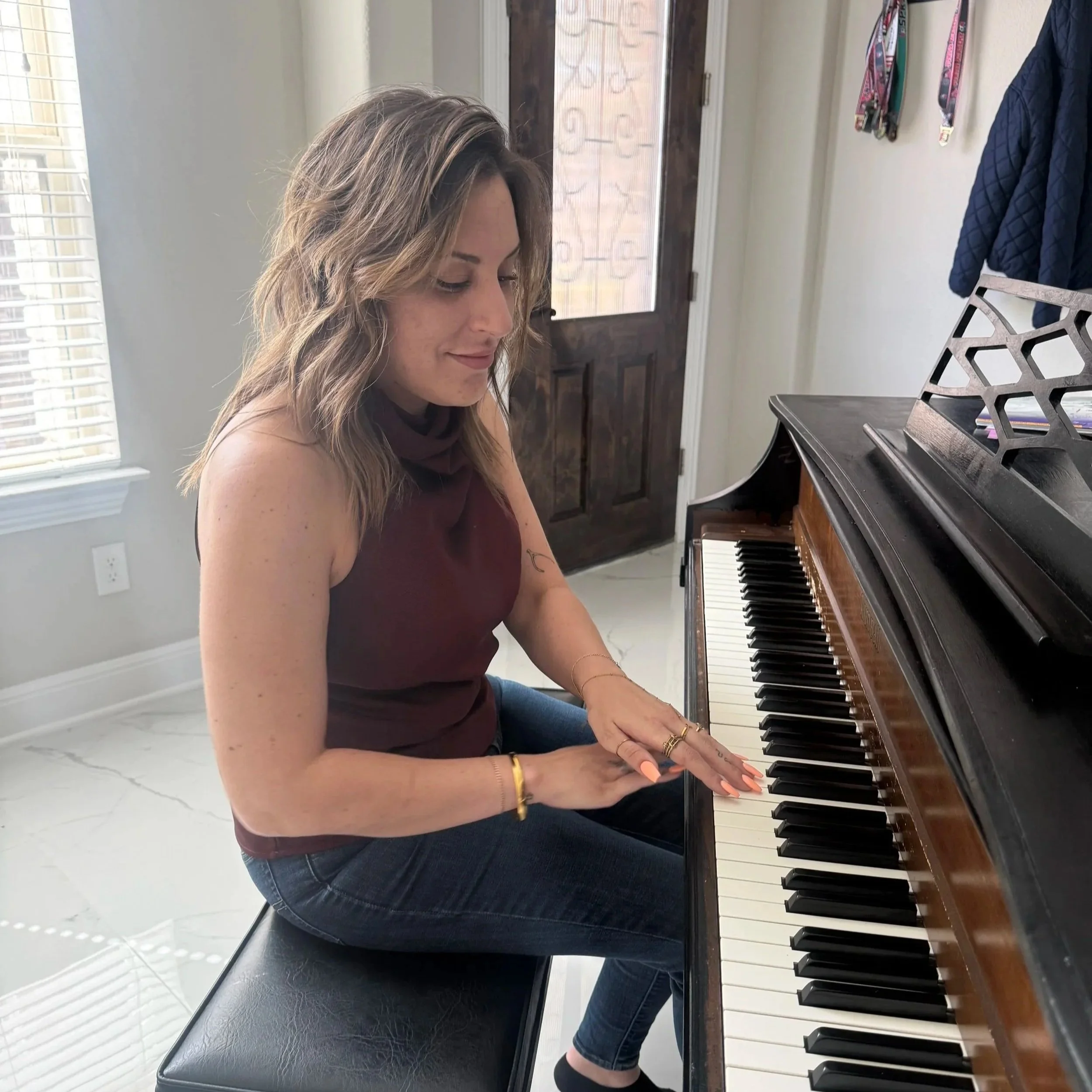 owner Alex playing piano