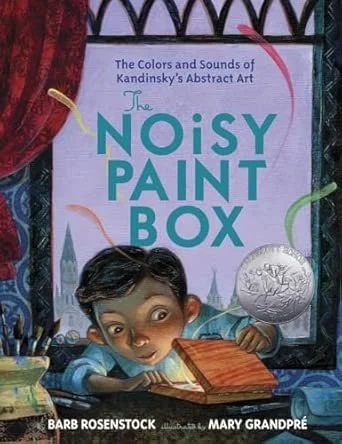 Book cover titled "The Noisy Paint Box" by Barb Rosenstock with illustrations by Mary Grandpré, depicting a boy drawing in a book with a window behind him showing a moon and trees.